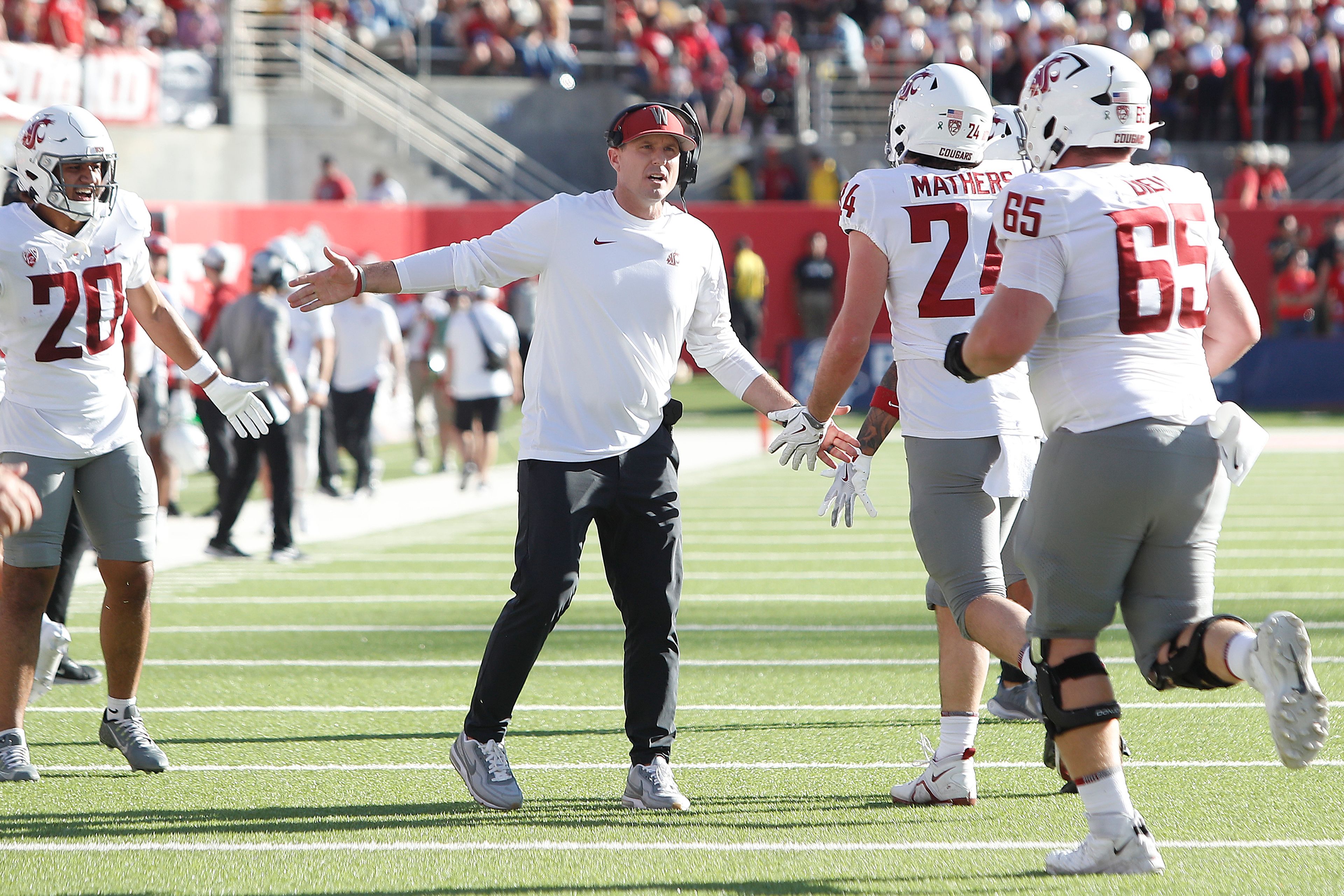 Washington State head coach Jake Dickert cheers on his players against Fresno State during the first half of an NCAA college football game in Fresno, Calif., Saturday, Oct. 12, 2024. (AP Photo/Gary Kazanjian)