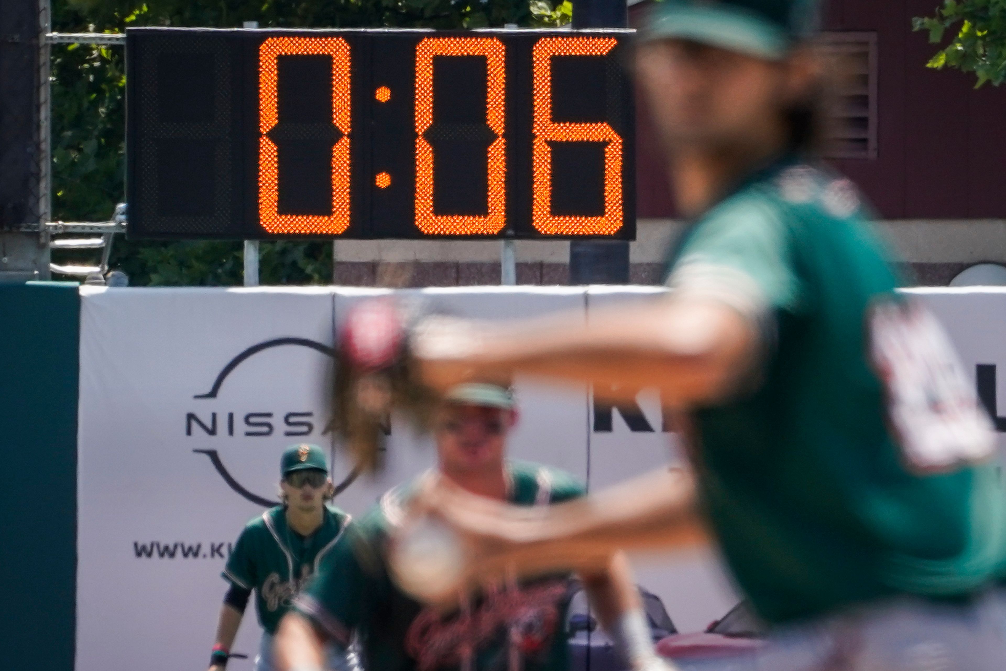 FILE - A pitch clock is deployed to restrict pitcher preparation times during a minor league baseball game between the Brooklyn Cyclones and Greensboro Grasshoppers, July 13, 2022, in the Coney Island neighborhood of the Brooklyn borough of New York. Major League Baseball is set to announce a pitch clock and limits on defensive shifts next season in an effort to shorten games and increase offense. The sportâ€™s 11-man competition committee is set to adopt the rules changes Friday, Sept. 9. (AP Photo/John Minchillo, File)