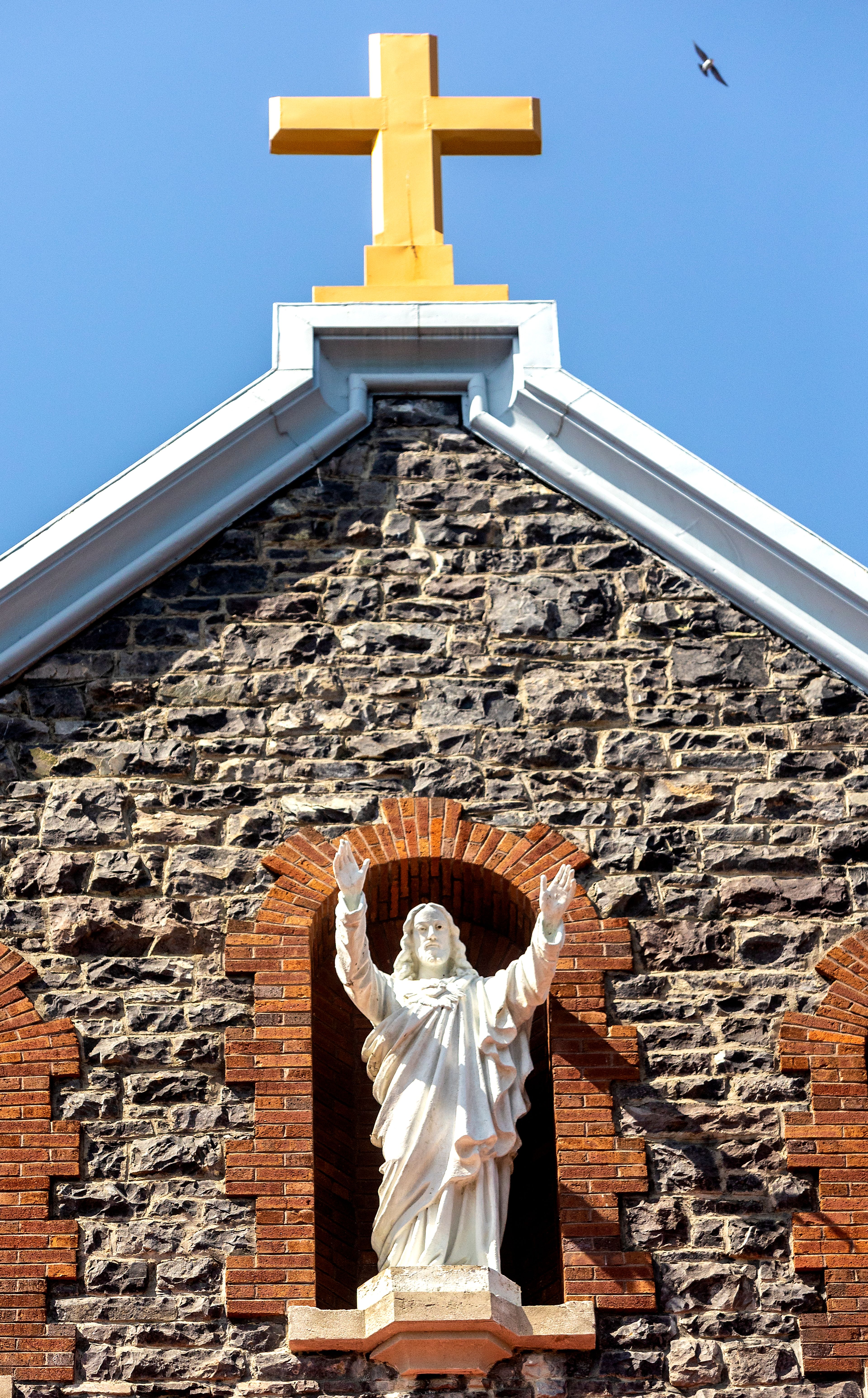 A bird flies above the St. Gertrude Monastery near Cottonwood.