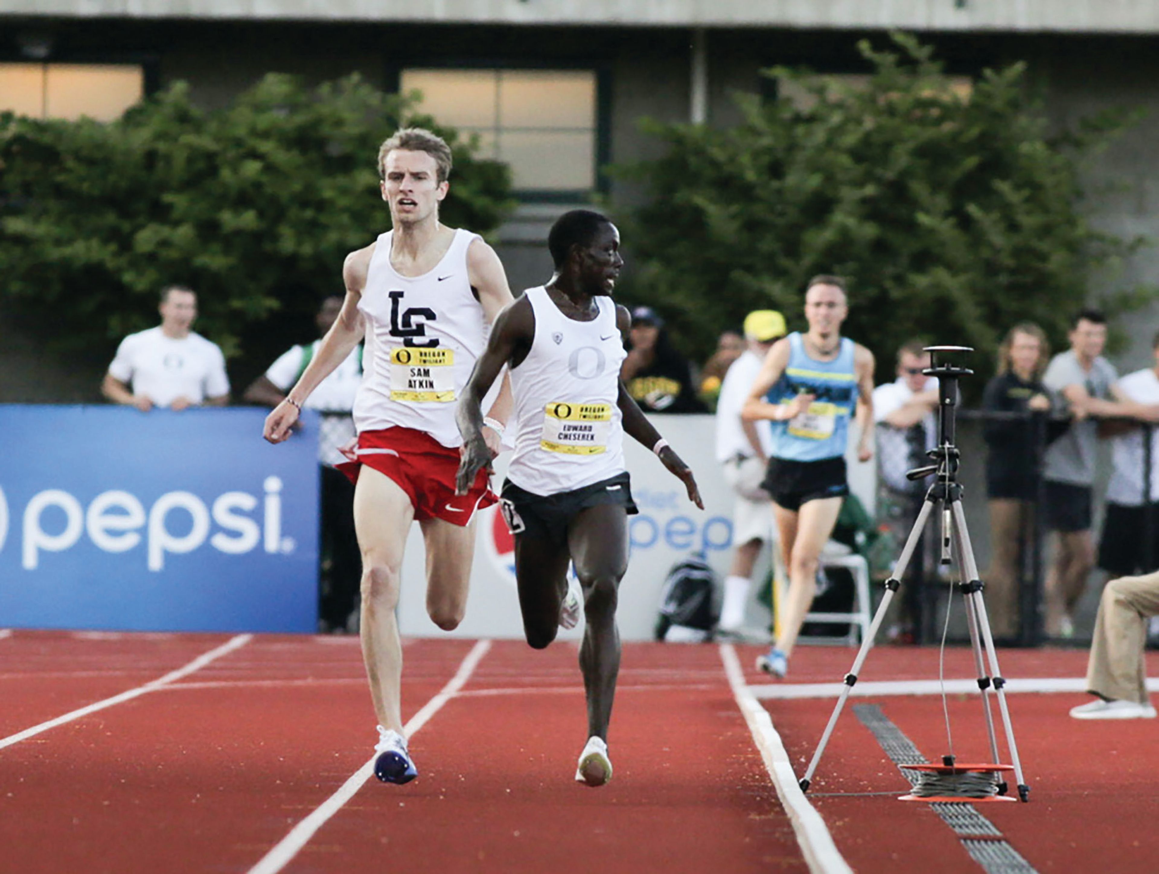 Lewis-Clark State’s Sam Atkin passes Oregon distance runner Edward Cheserek during the May 6, 2016, Oregon Twilight at Hayward Field in Eugene, Ore. Atkin will be inducted into the college’s athletic Hall of Fame on Saturday.