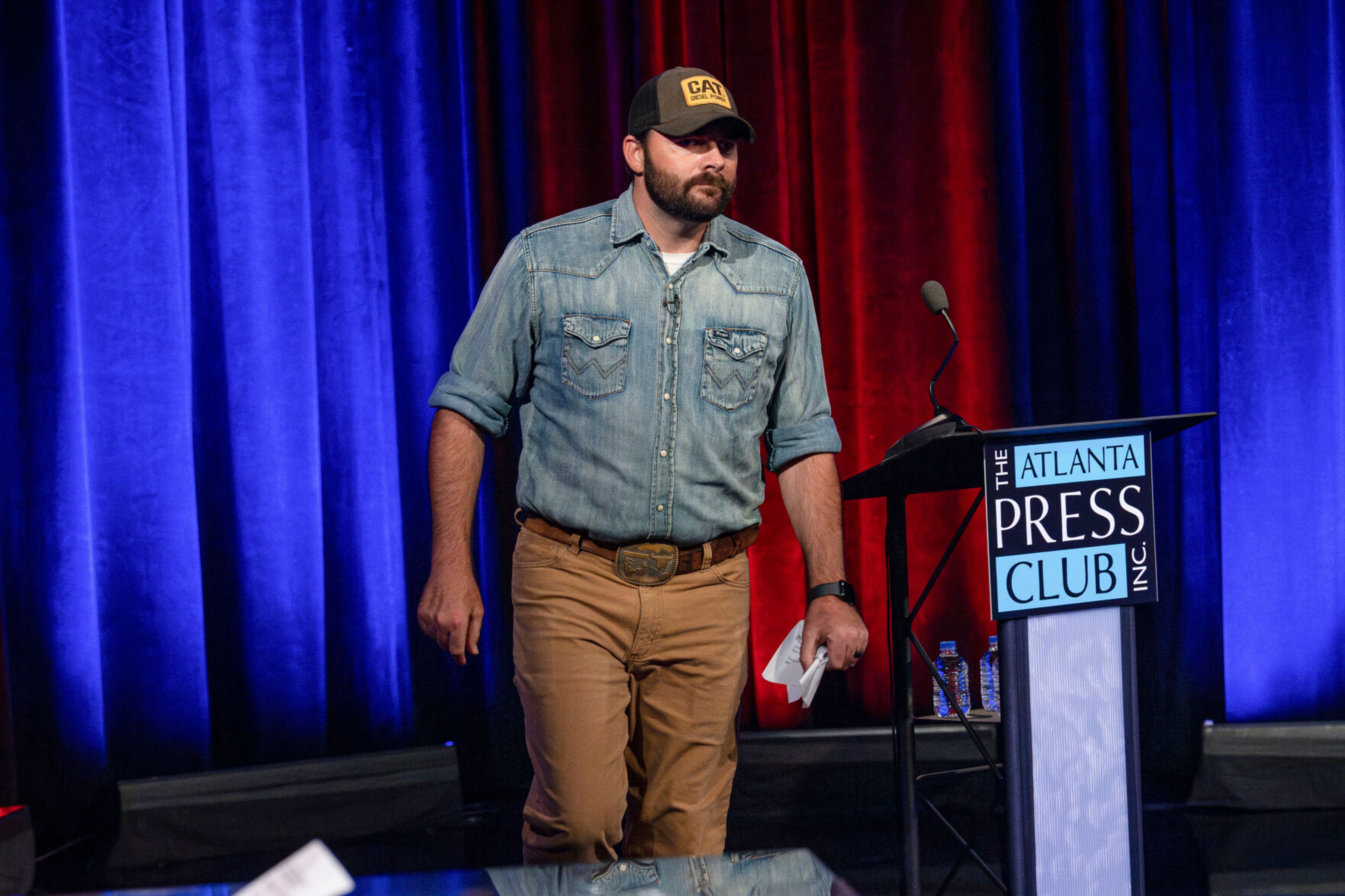 Georgia Republican convicted in Jan. 6 riot walks out during televised congressional primary debate