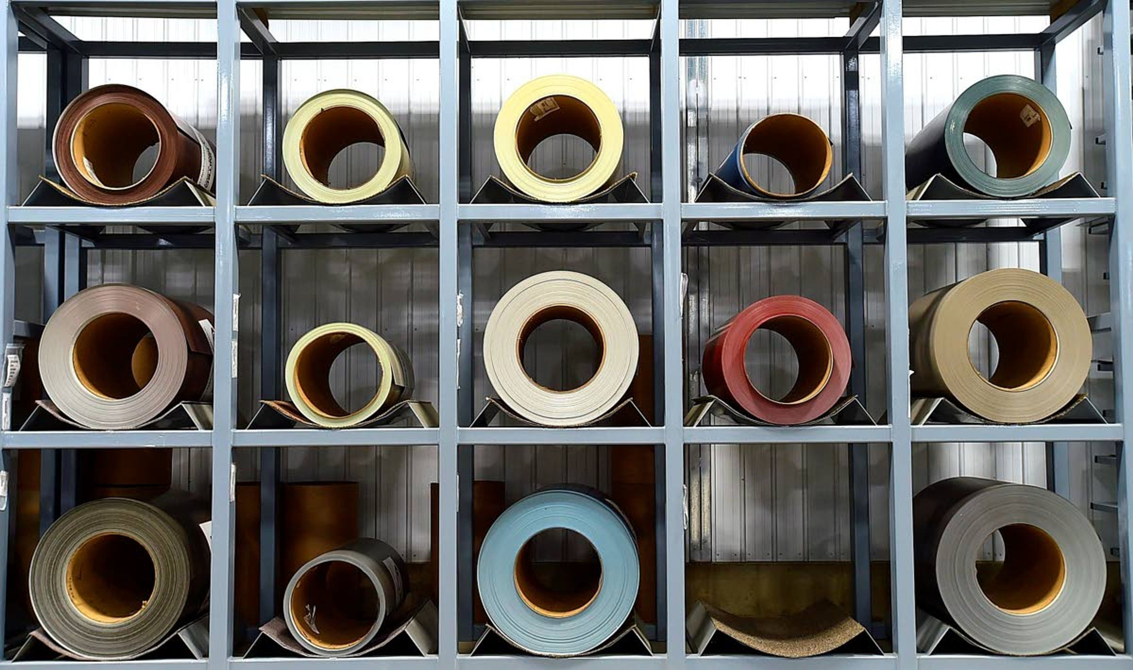 Rolls of steel wait to be turned into roofing and siding materials at the Golden Valley Hutterite Colony near Ryegate, Mont. (Larry Mayer/Billings Gazette via AP)