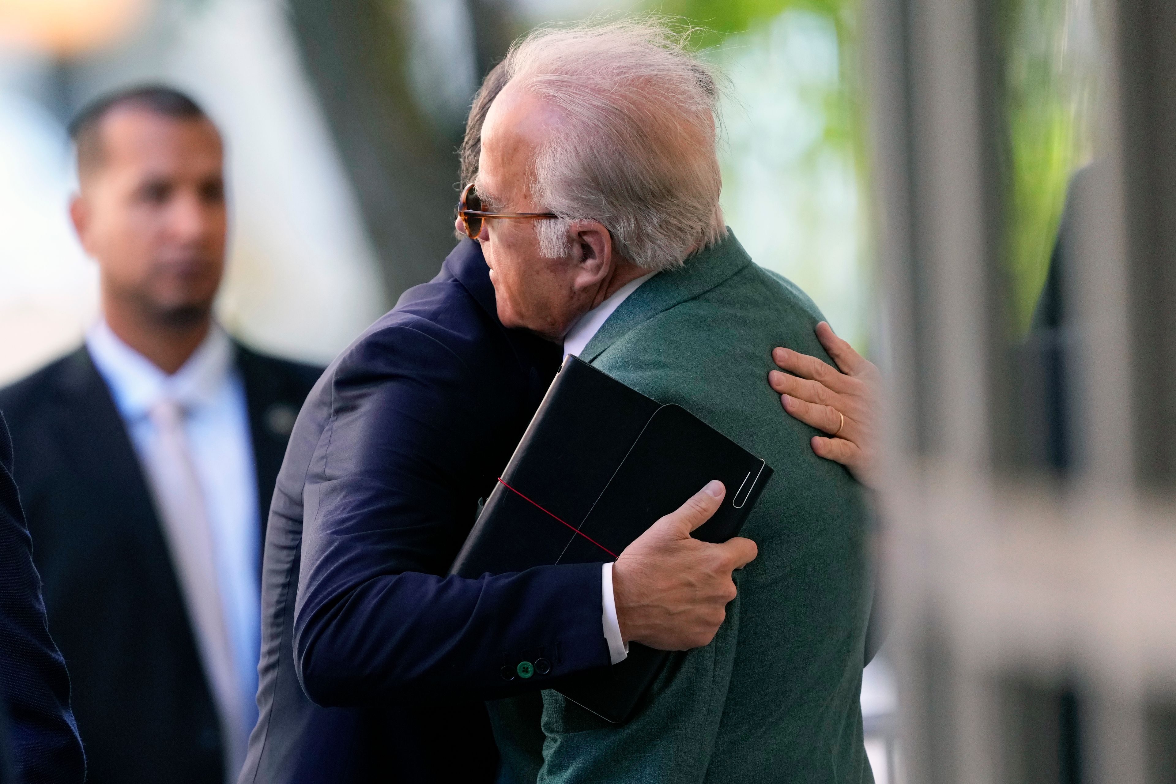 Hunter Biden hugs James Biden after arriving to federal court, Monday, June 10, 2024, in Wilmington, Del.