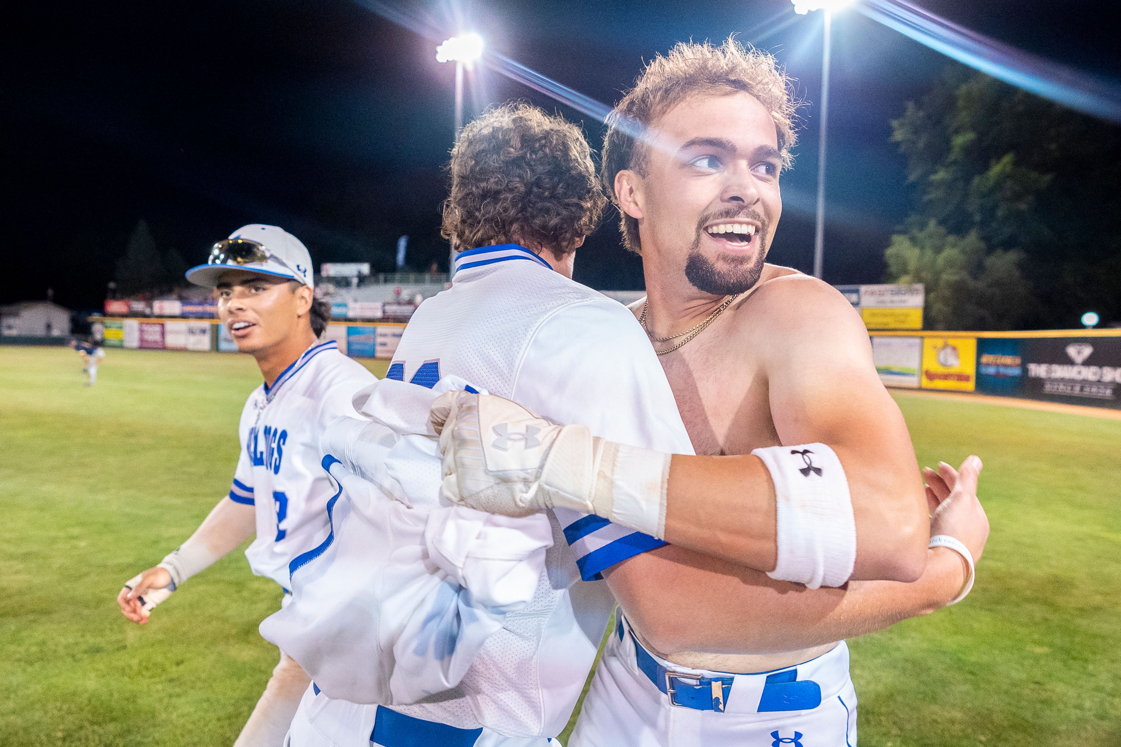 Tennessee Wesleyan’s Kruise Newman, right, celebrates with teammates after hitting the game winning single during Game 18 of the NAIA World Series against Reinhardt on Thursday at Harris Field in Lewiston.