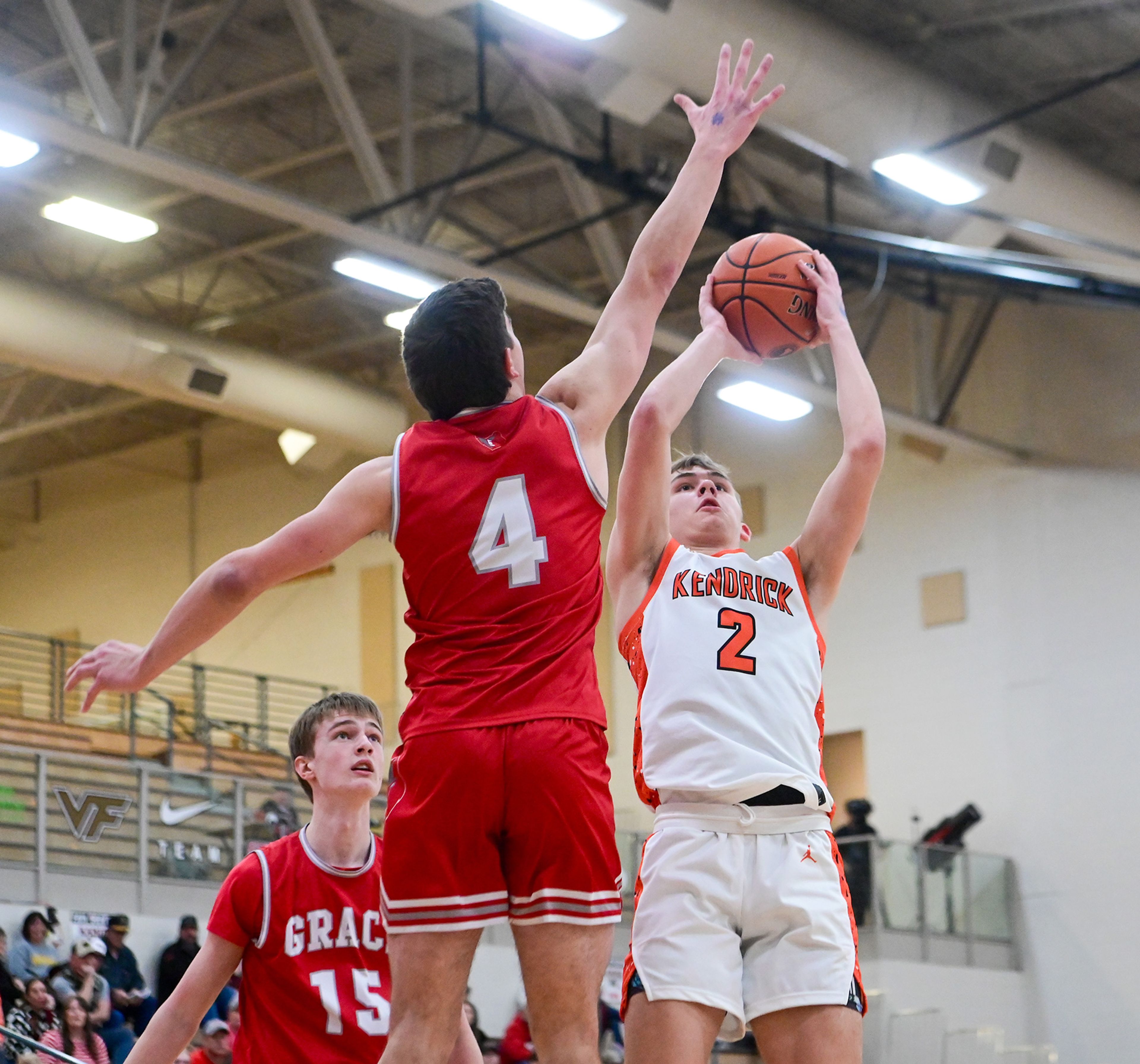 Kendrick's Ralli Roetcisoender attempts a two-point shot with pressure from Grace's Braden Kimball at the Idaho 2A state tournament on Friday in Caldwell, Idaho.