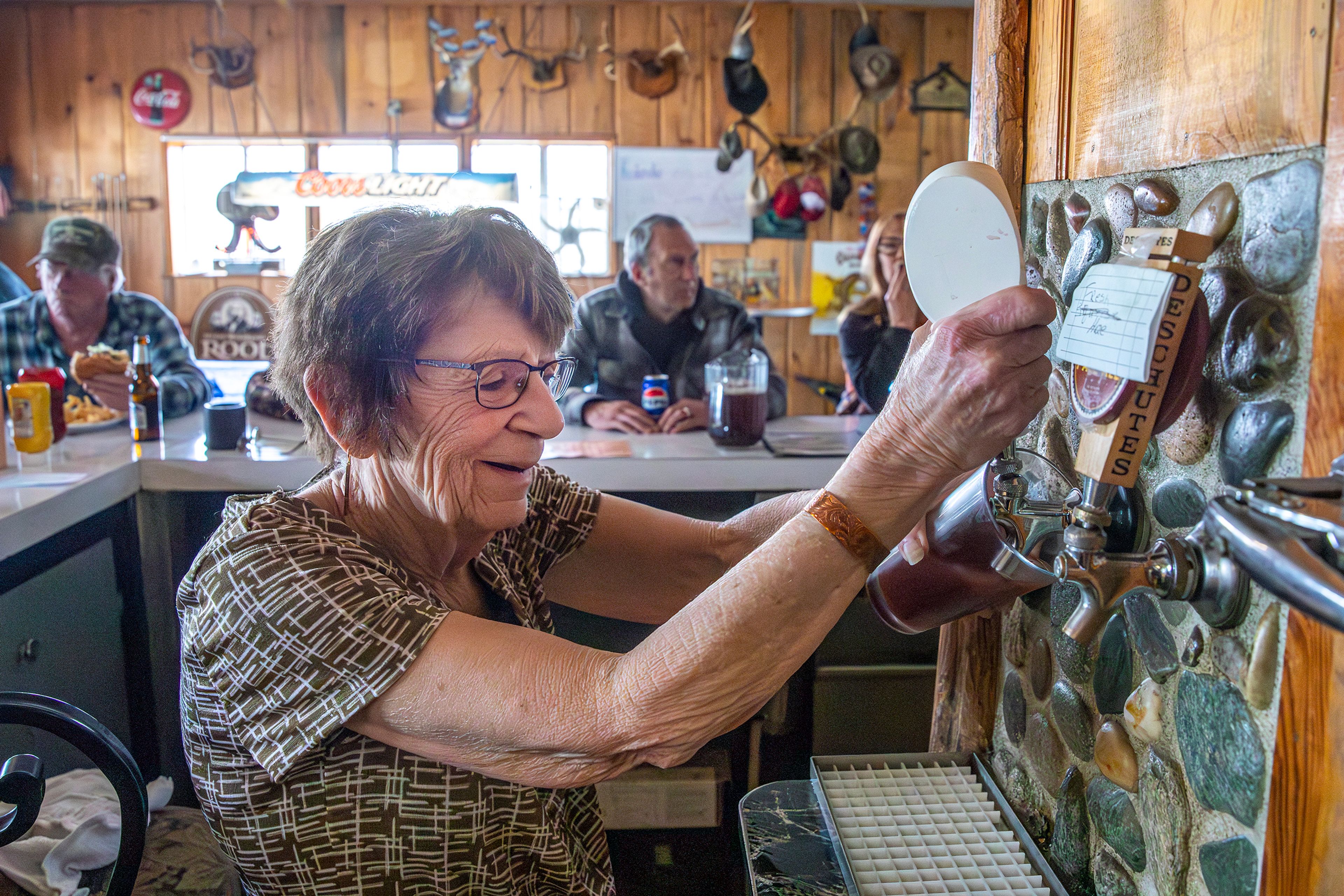 Linda Elliot fills up a mug Thursday at the Keuterville Pub & Grub.