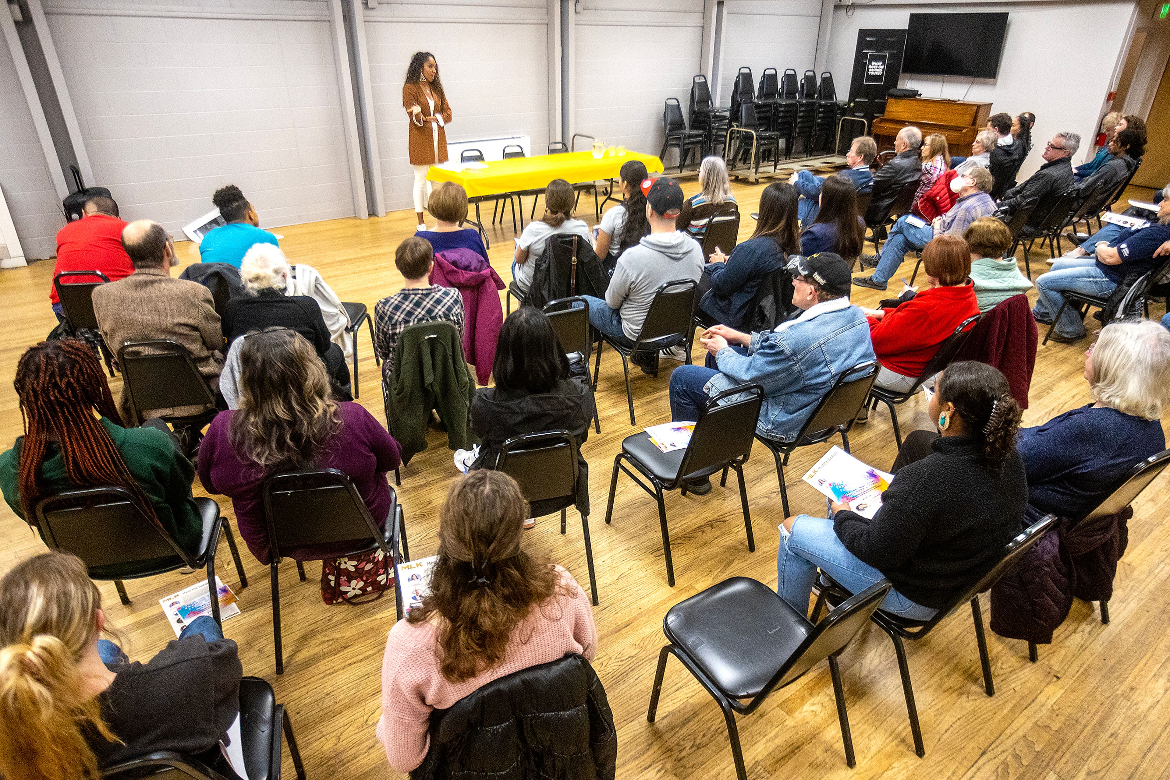 Around 50 people listen to Mikailah Thompson speak during the YWCA Martin Luther King Jr. Day event Monday in Lewiston.