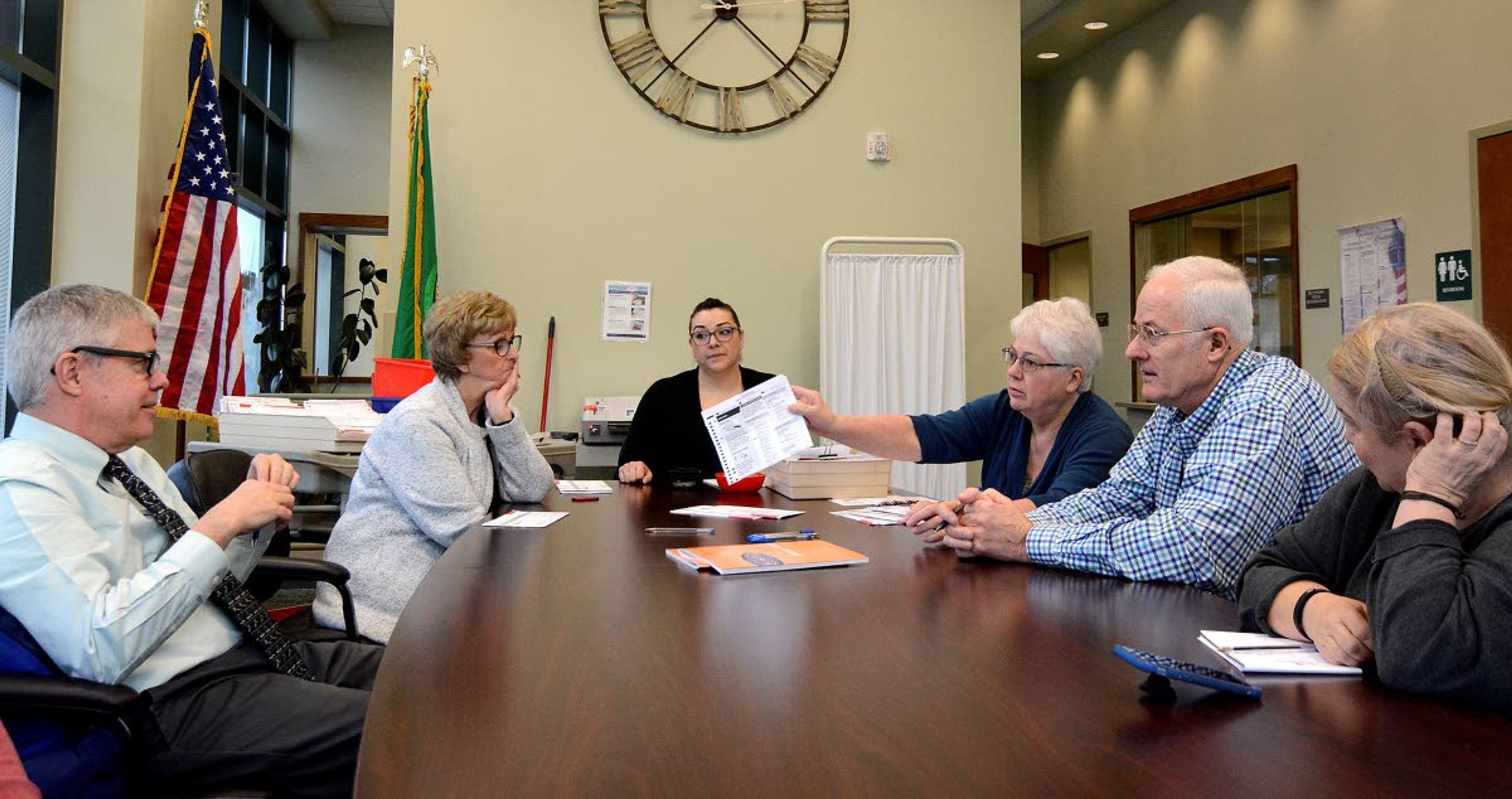 Whitman County officials (from left) Denis Tracy, Cindy Pitts, Mishellena Stanley, Eunice Coker, Dean Kinzer and Michele Beckmann examine nearly 500 ballots from the last election that were determined to have eligibility issues.