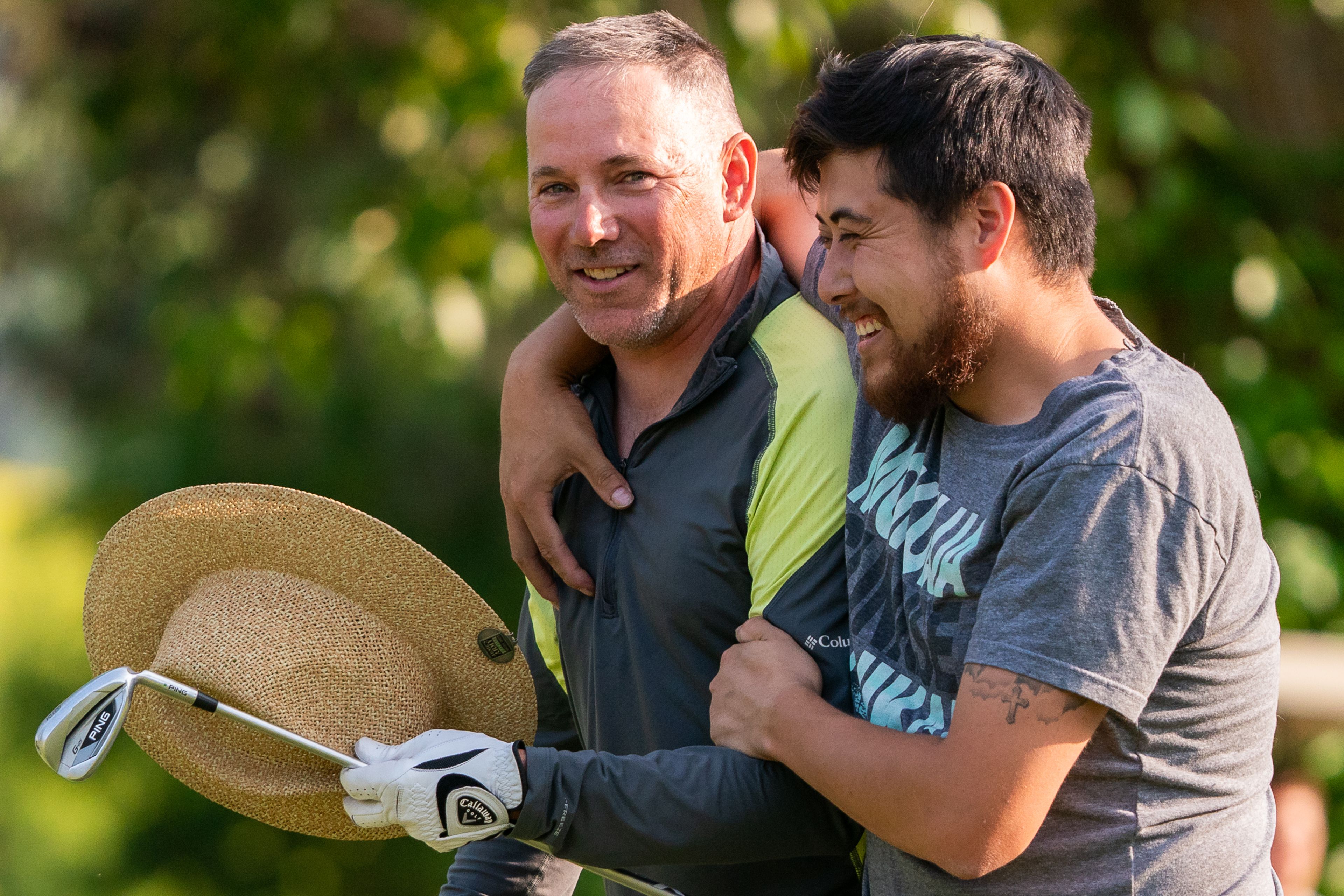 Jeffrey Spellman, left, is congratulated by Cris Quesada after winning the 74th annual Moscow Elks Sole Survivor golf tournament on Tuesday.