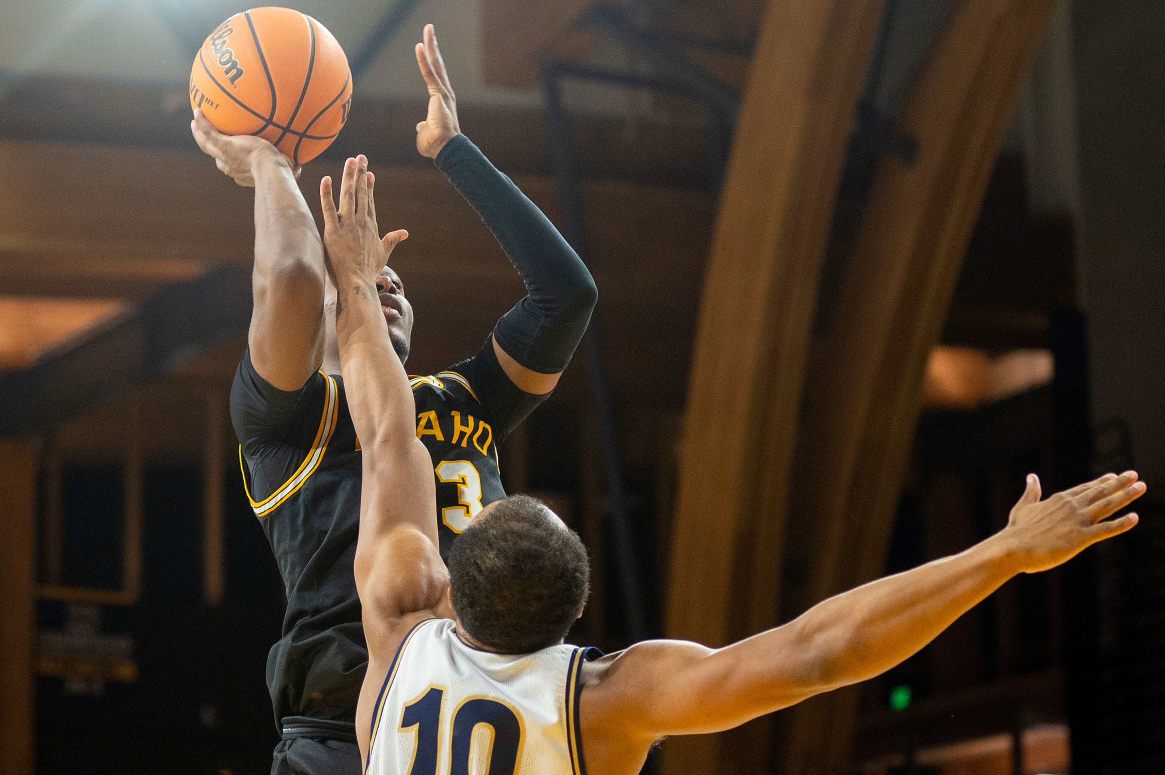 Idaho guard Divant'e Moffitt takes a jump shot over Montana State guard Darius Brown II during the first half of Monday&#x2019;s Big Sky Conference game at Idaho Central Credit Union Arena.