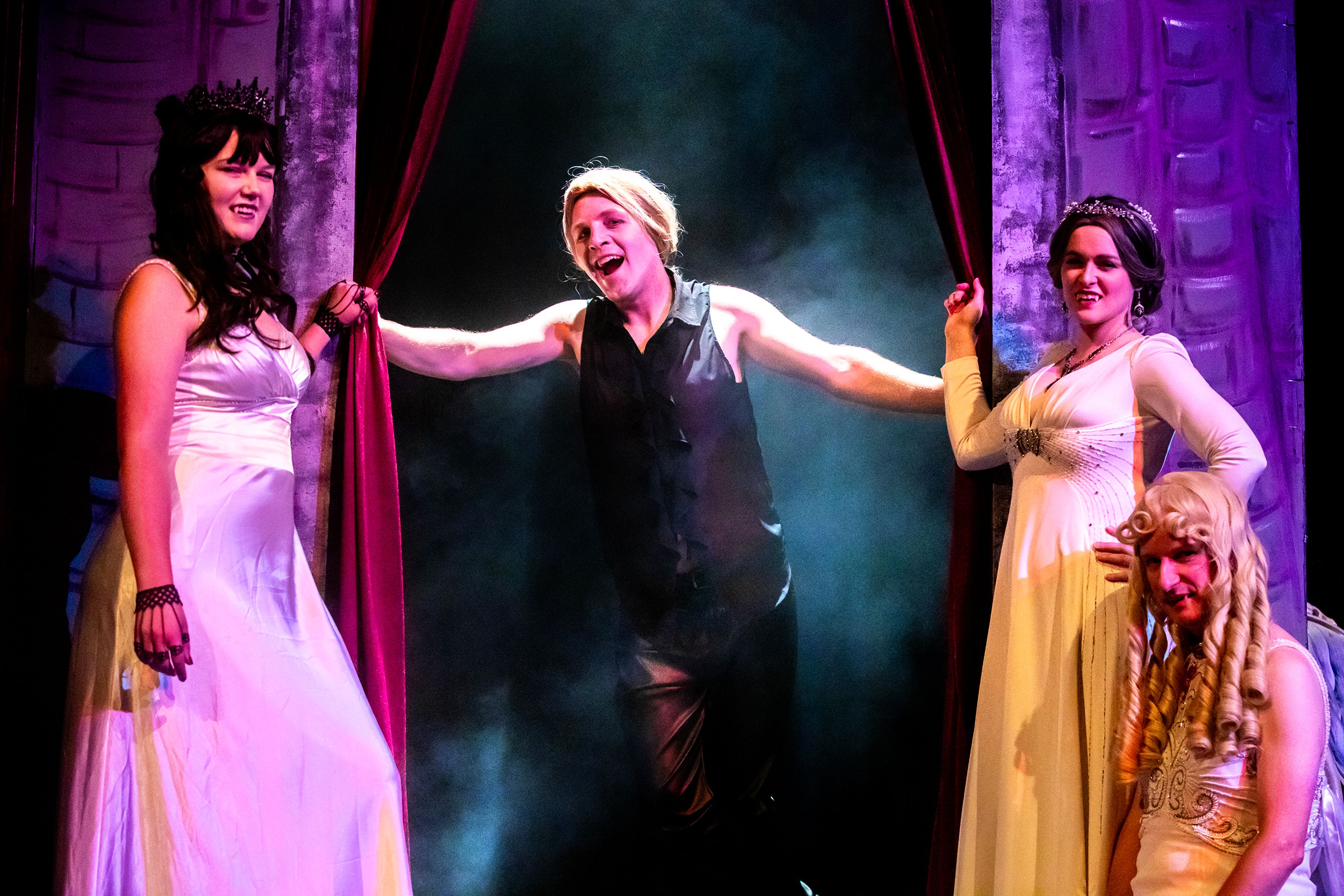 Dracula, played by Micheal Keene, emerges from a curtain with his brides on either side, played by Rachel Sila, from left, Taylor Wilkins and Travis Osburn for the Lewiston Civic Theatre production of �Dracula� Tuesday, Sept. 17, in Lewiston.,