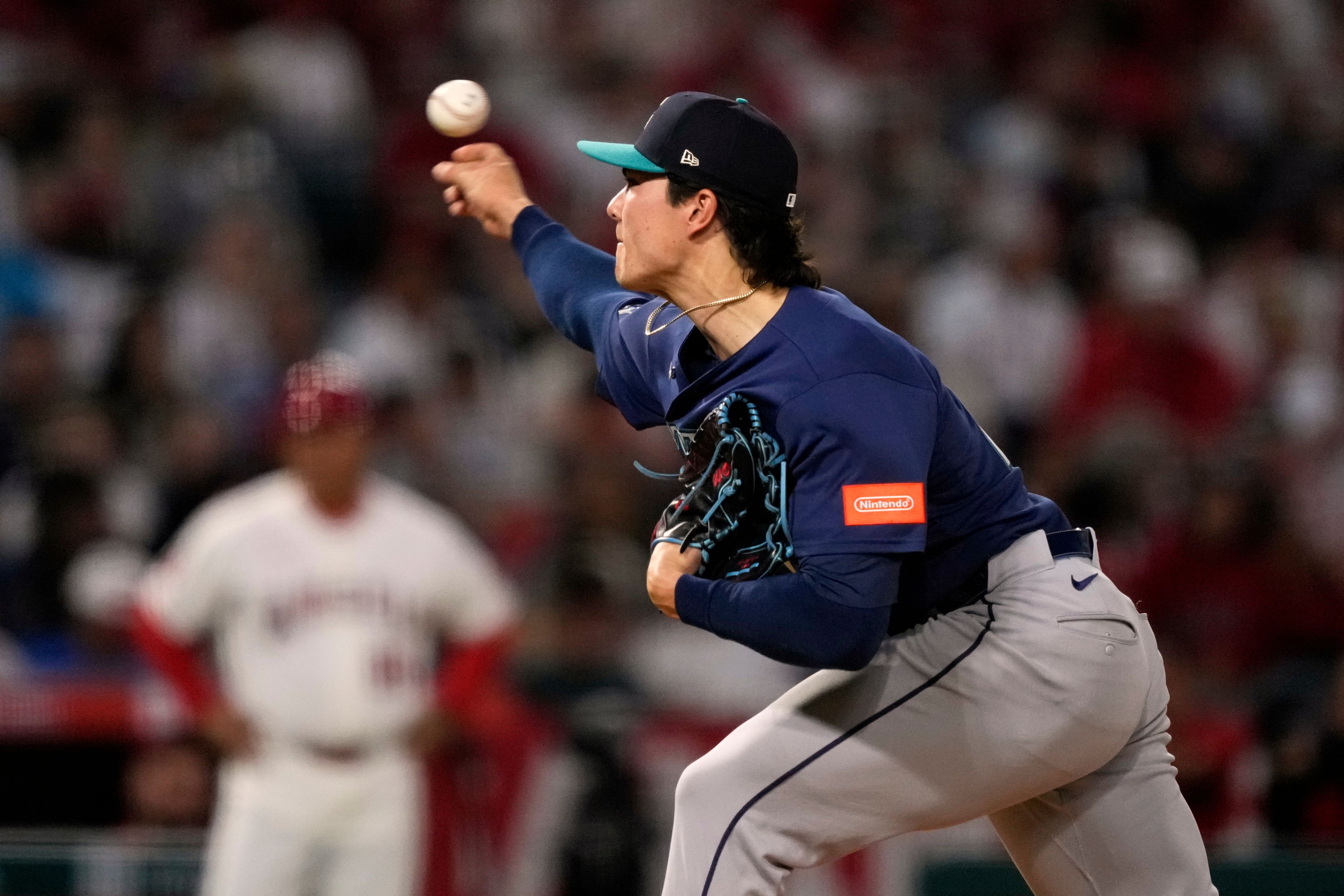 Woo, Mariners beat Angels in extra innings