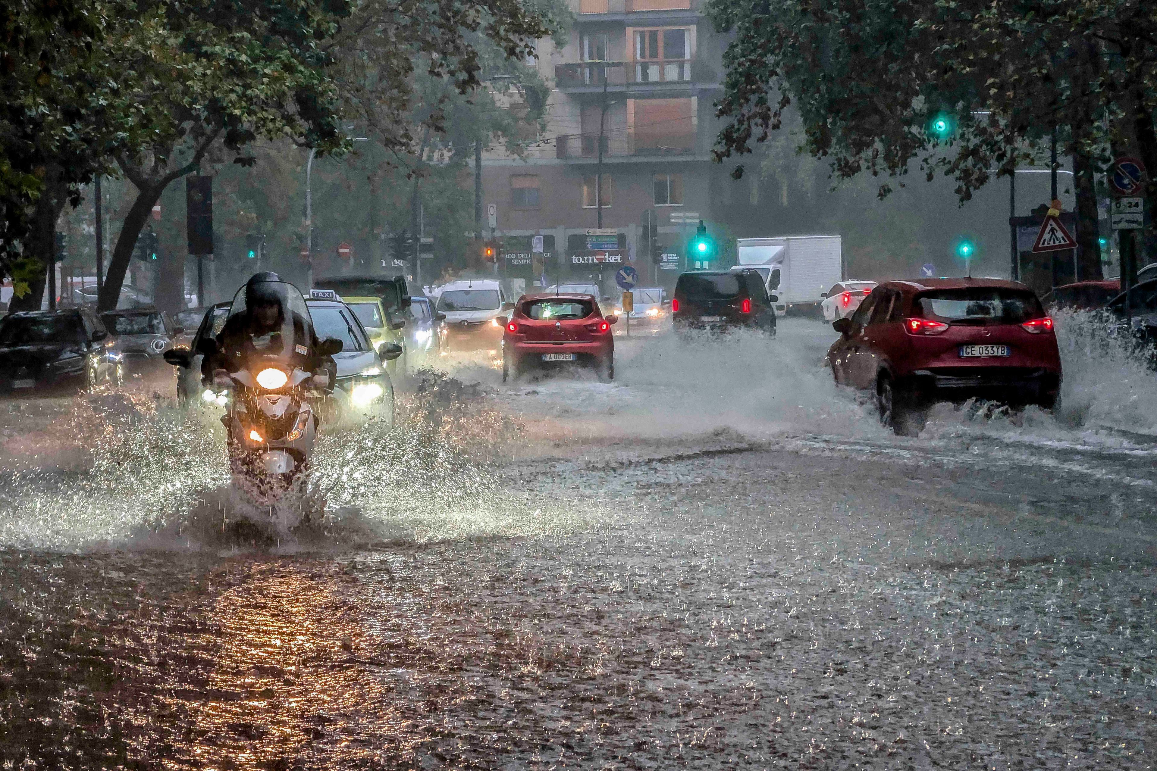 Residents wade through flooded streets in Milan, northern Italy, Thursday, Sept. 5, 2024. Lombardy and Veneto have been hit by widespread flooding, causing damage and disruption in the city of Milan, where the local Seveso and Lambro rivers overflowed.