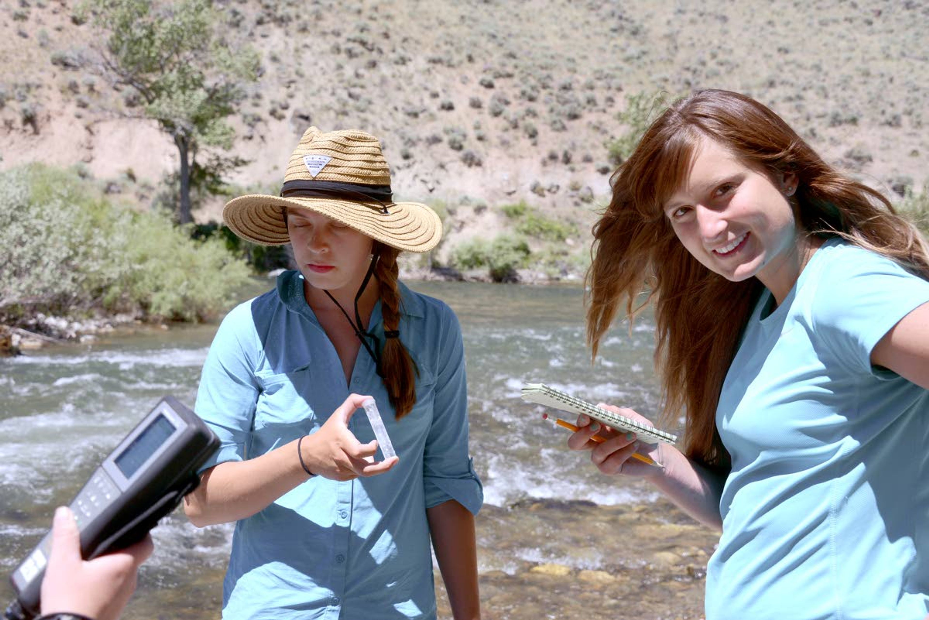 Karoline Woodhead and Melissa O'berto take water quality samples on the Salmon River.