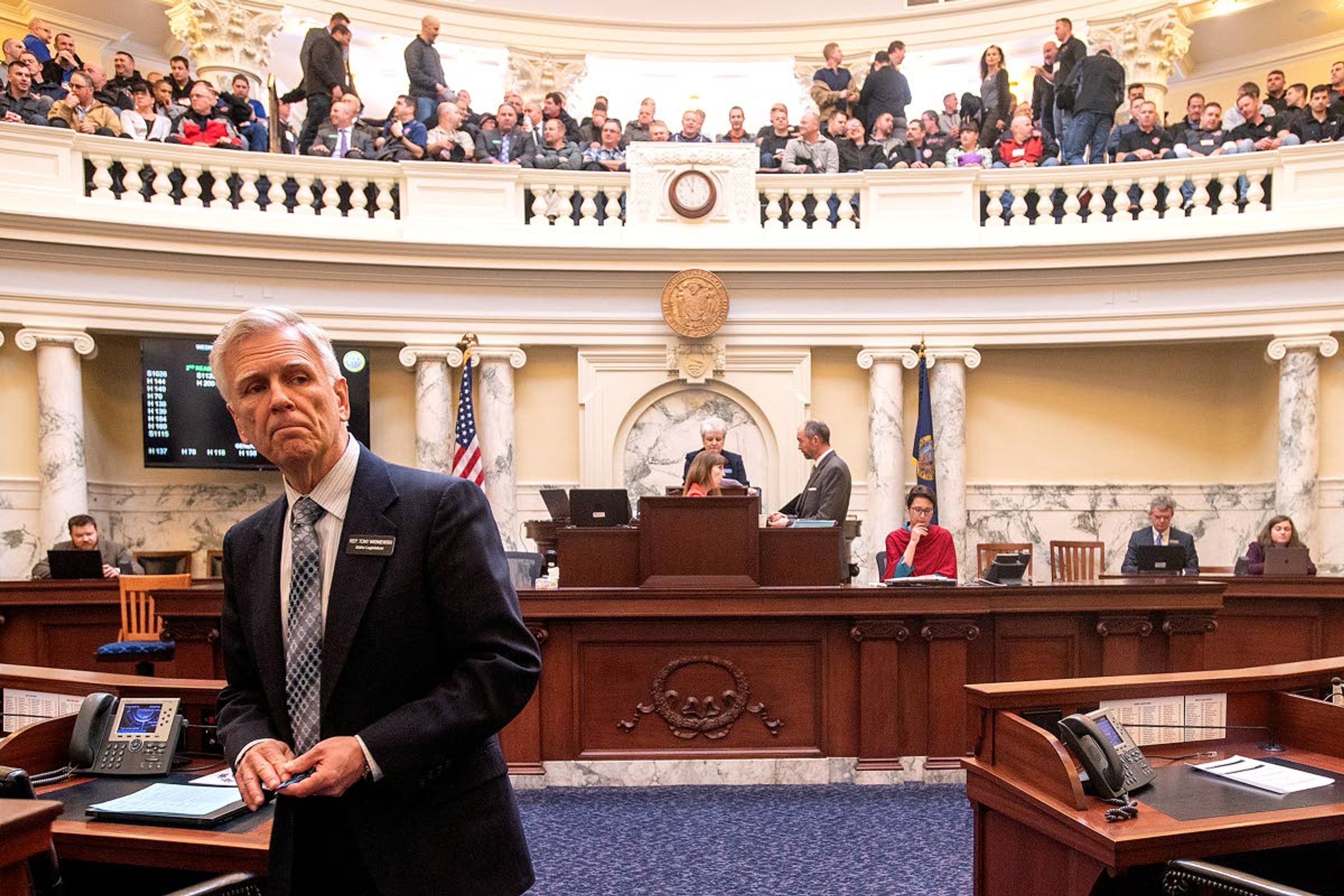 Rep. Tony Wisniewski, R-Post Falls, looks around as the gallery begins to fill up prior to the start a day's session recently at the Idaho Capitol Building in Boise.