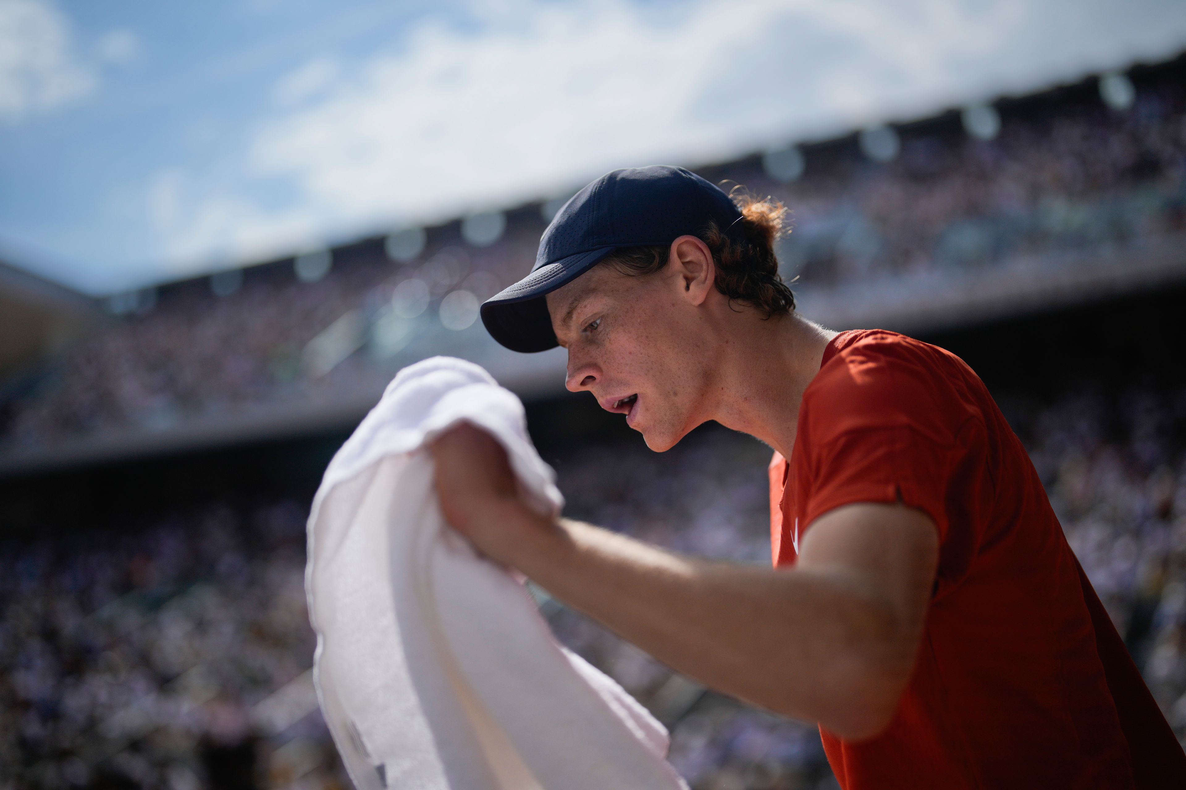 Italy's Jannik Sinner uses a towel during his quarterfinal match of the French Open tennis tournament against Bulgaria's Grigor Dimitrov at the Roland Garros stadium in Paris, Tuesday, June 4, 2024.