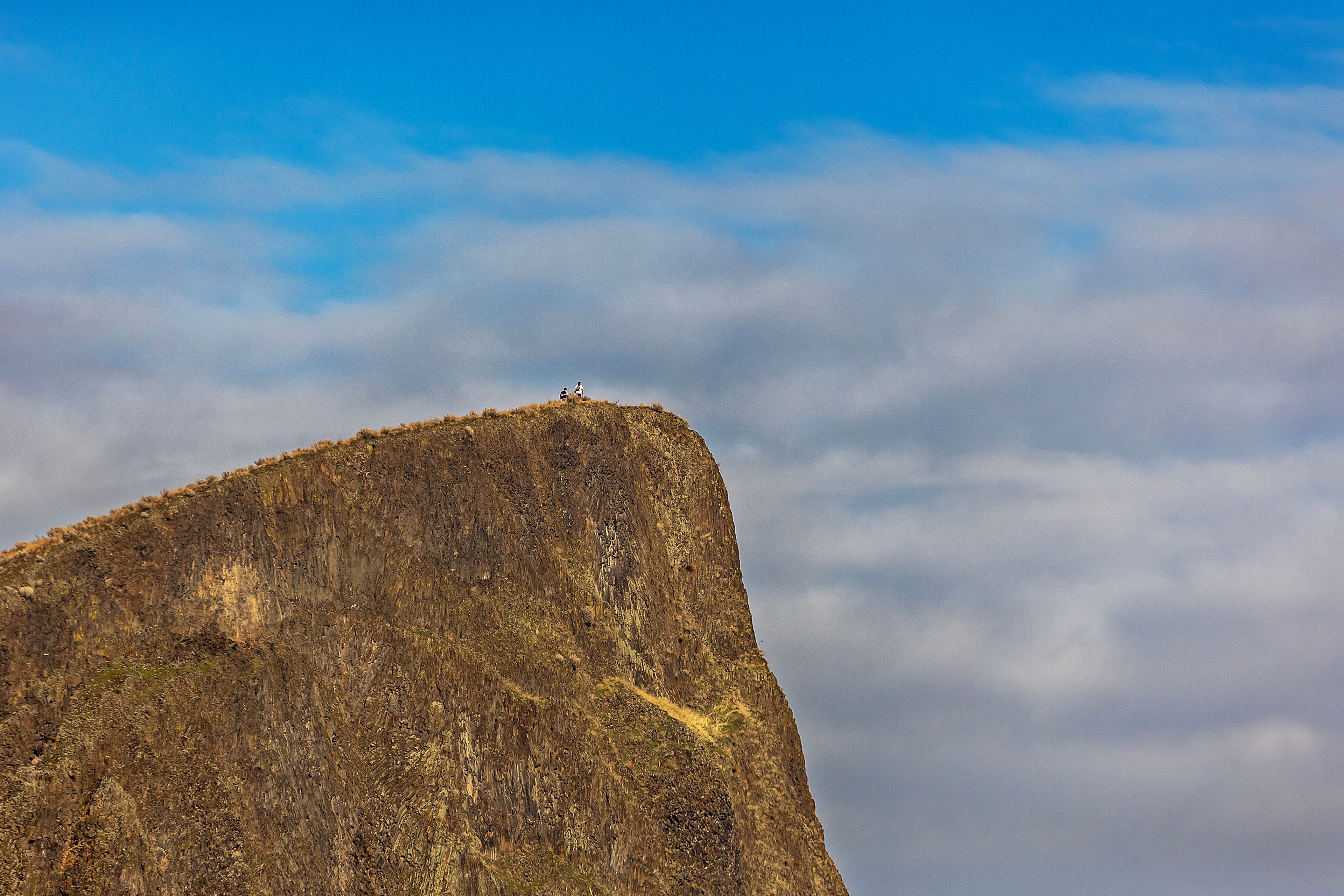 People stand atop Swallows Nest Rock for a sky high view Wednesday in Clarkston.