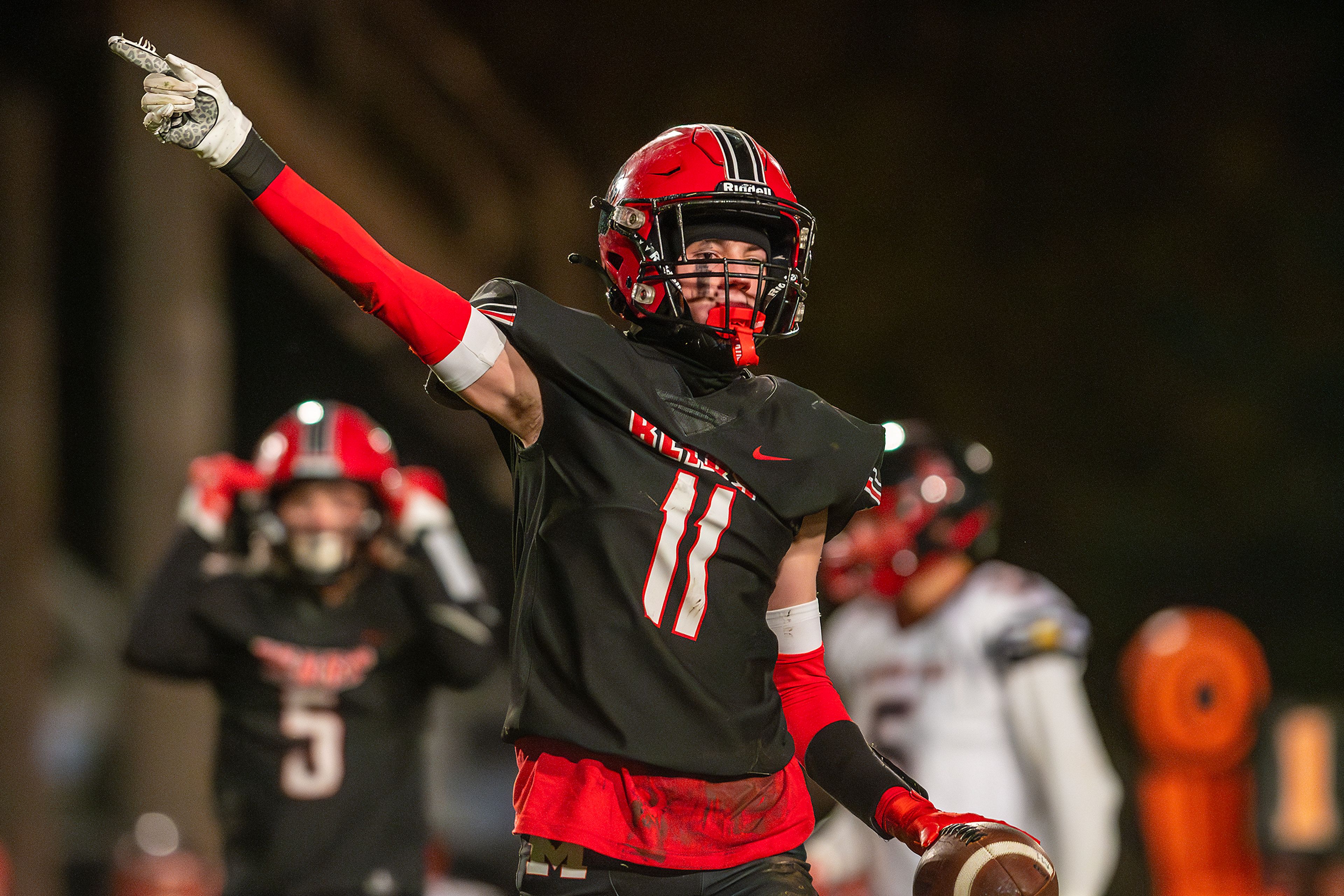 Moscow wide receiver Graysen Hennrich points down field after making a catch against American Falls during an Idaho 4A playoff game Friday in Moscow.