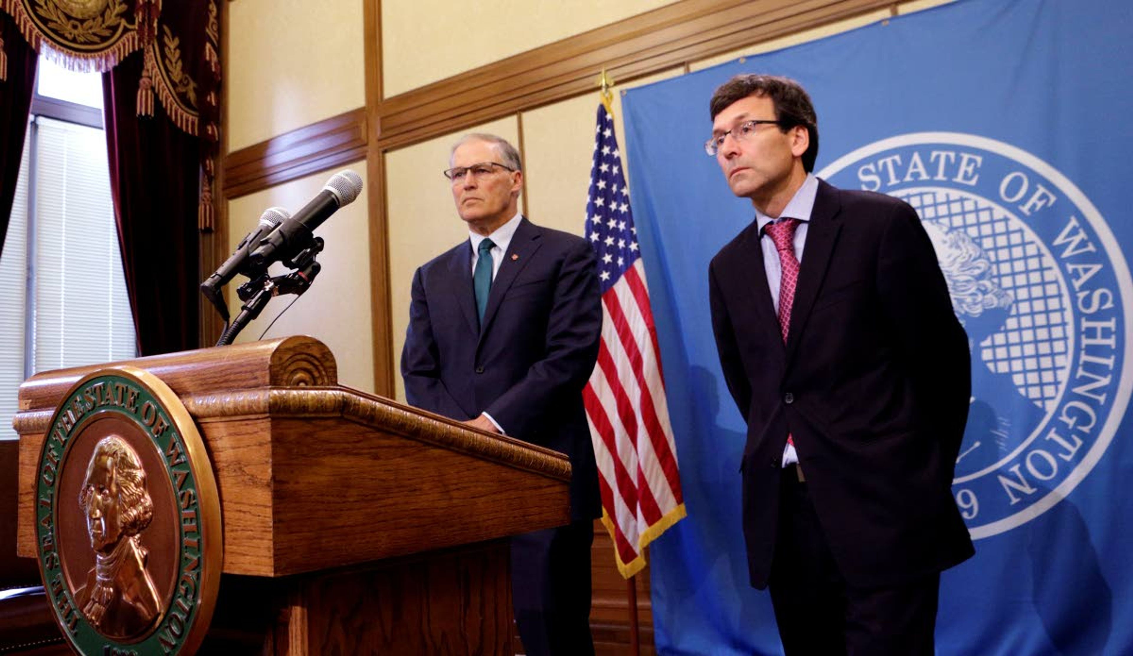 Gov. Jay Inslee, left, and Attorney General Bob Ferguson address a news conference following an earlier announcement that Washington's Supreme Court unanimously struck down the state's death penalty, Thursday, Oct. 11, 2018, in Olympia, Wash. Washington has had a moratorium on executions since 2014, but the ruling makes it the 20th state to do away with capital punishment by legislative act or court decree. The court converted the sentences of the eight people on Washington's death row to life in prison. (AP Photo/Rachel La Corte)