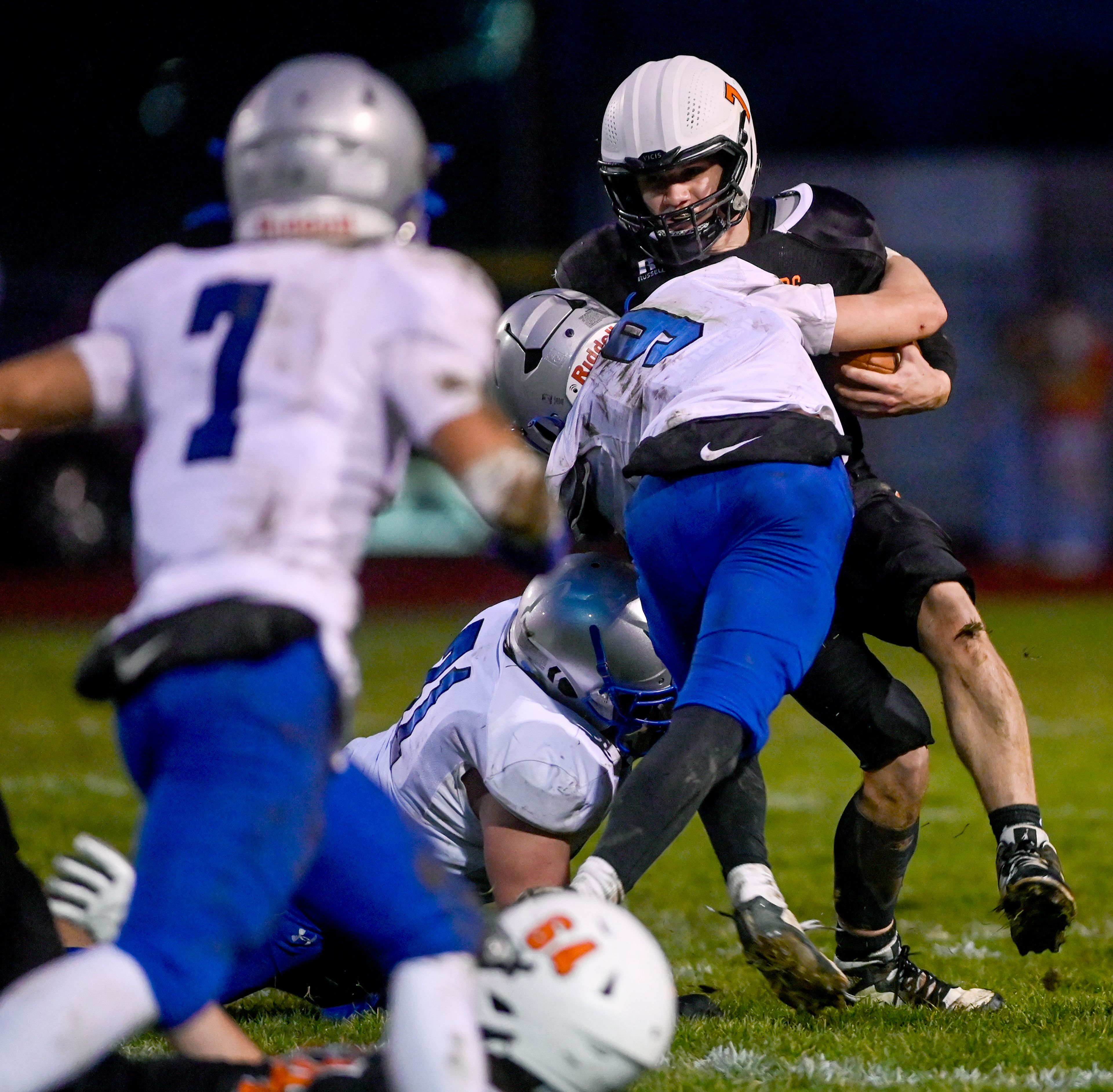 Asotin’s Cody Ells is tackled by La Salle’s Kai Hanrahan Saturday during a Washington 2B state tournament game in Clarkston.