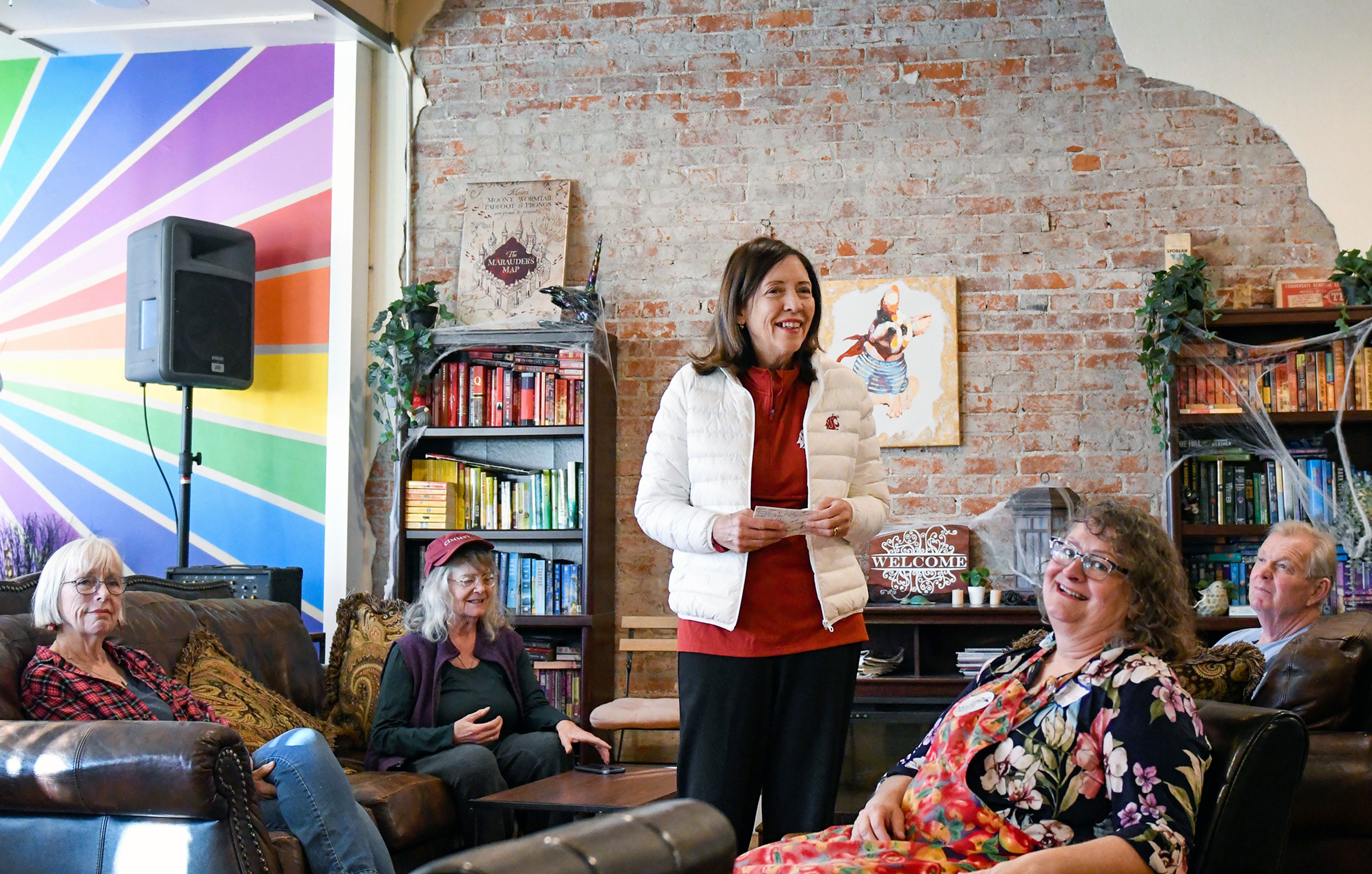 U.S. Sen. Maria Cantwell, center, kicks off a phone banking and canvassing event with the Whitman County Democrats team and supporters Thursday at Pups & Cups Cafe in Pullman.