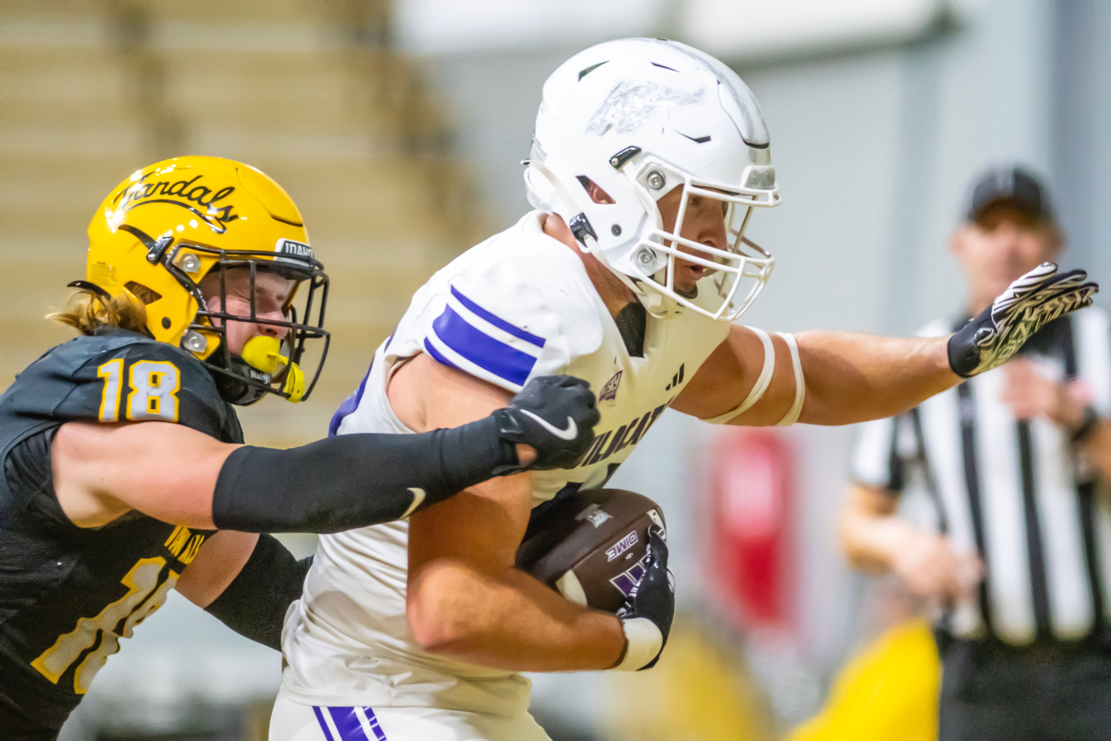 Weber State tight end Keayen Nead scores a touchdown as Idaho defensive back Tommy McCormick tries to stop him during a quarter of a Big Sky conference game Saturday at the P1FCU Kibbie Dome in Moscow.