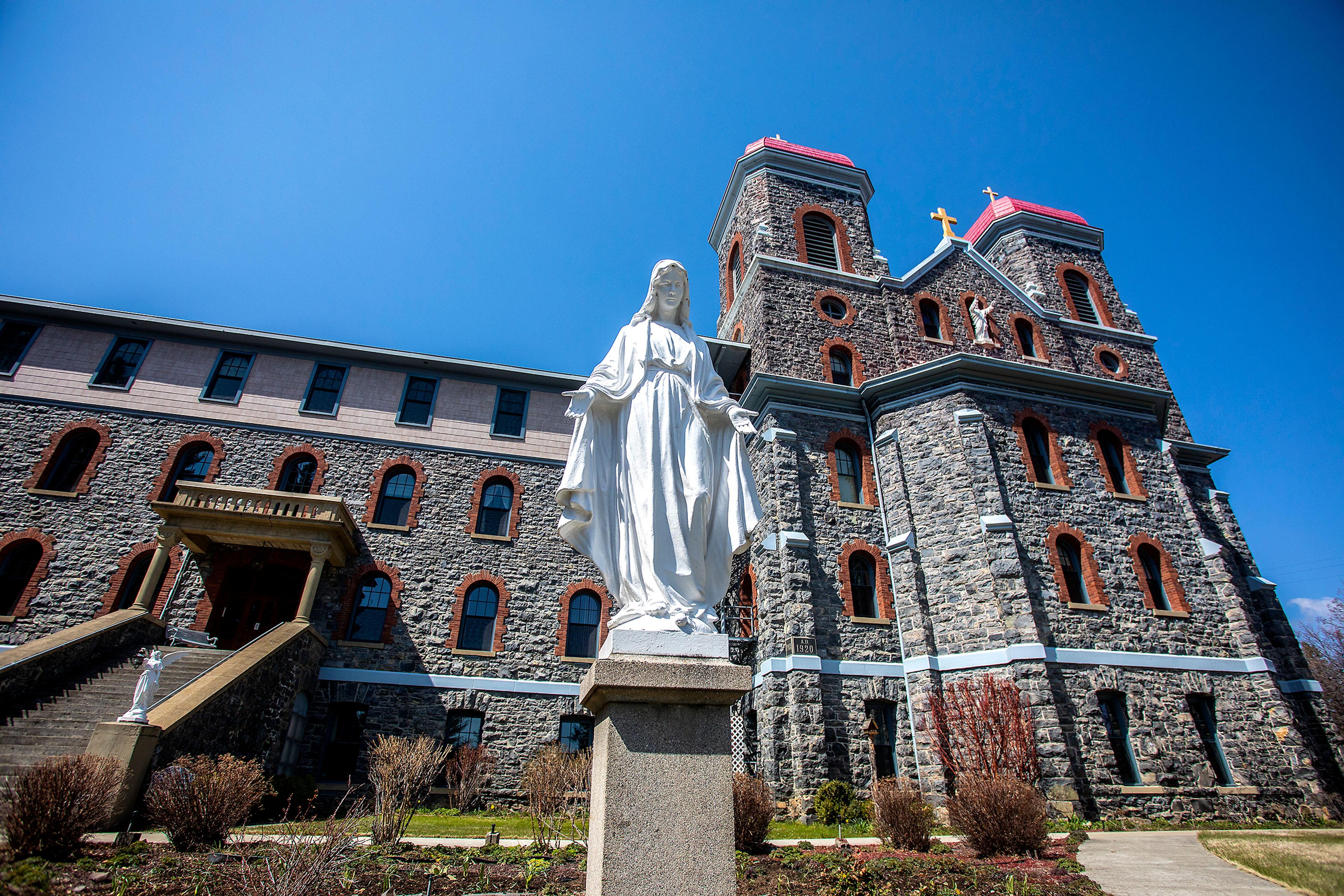 RIGHT: St. Gertrude Monastery is seen near Cottonwood recently.BELOW: A bronze statue by David Manuel titled “The Protector” is on display at the Historical Museum at St. Gertrude, located on the monastery campus.Barry Kough/For Daytripping