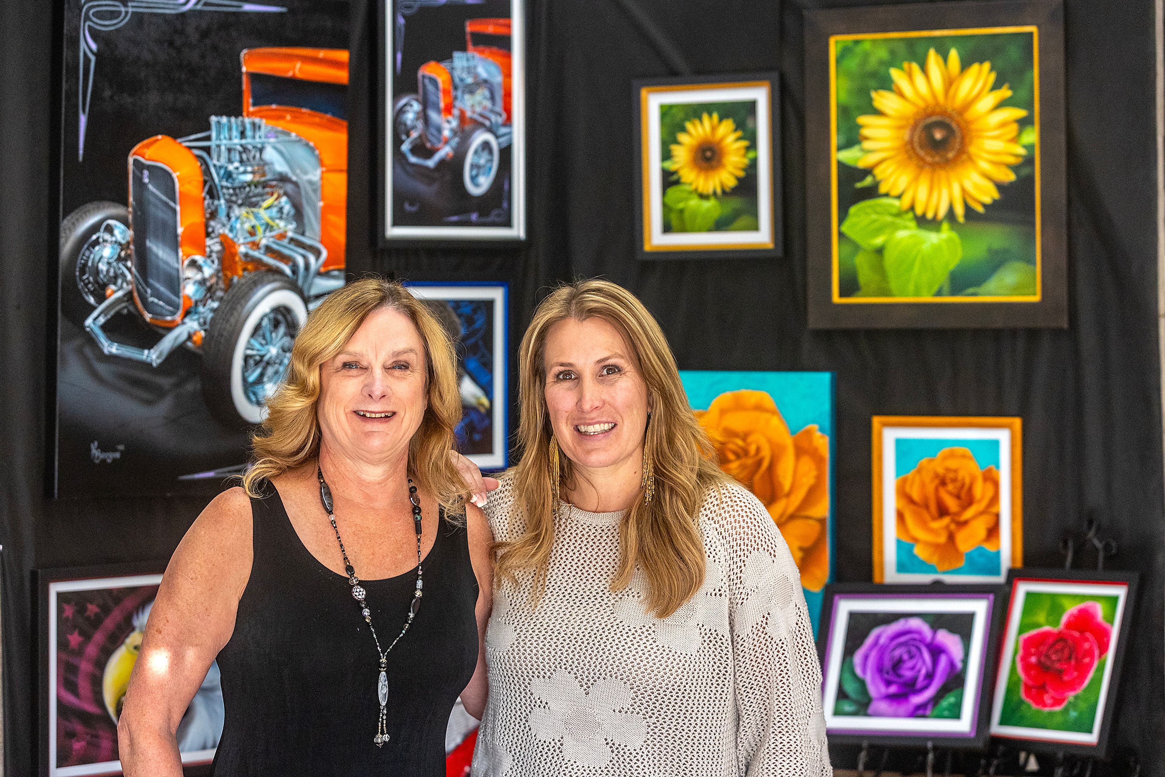 Debbie Zenner, owner DZ Designs, Beautiful Downtown Lewiston board member and Artwalk chairperson, and Tami Meyers, BDL board chairperson, are pictured for a portrait in front of artwork by Kevin Beeson Monday in Lewiston.,