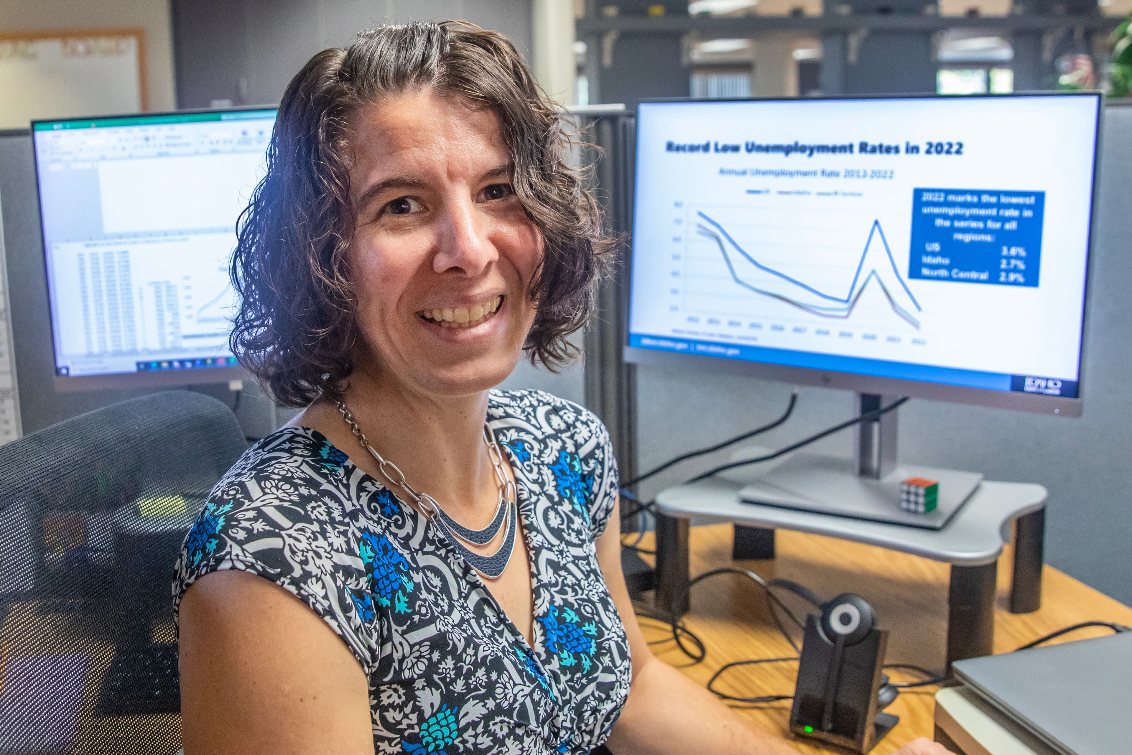 Lisa Grigg, labor economist with the Idaho Department of Labor, poses for a photo at her desk Wednesday in Lewiston.