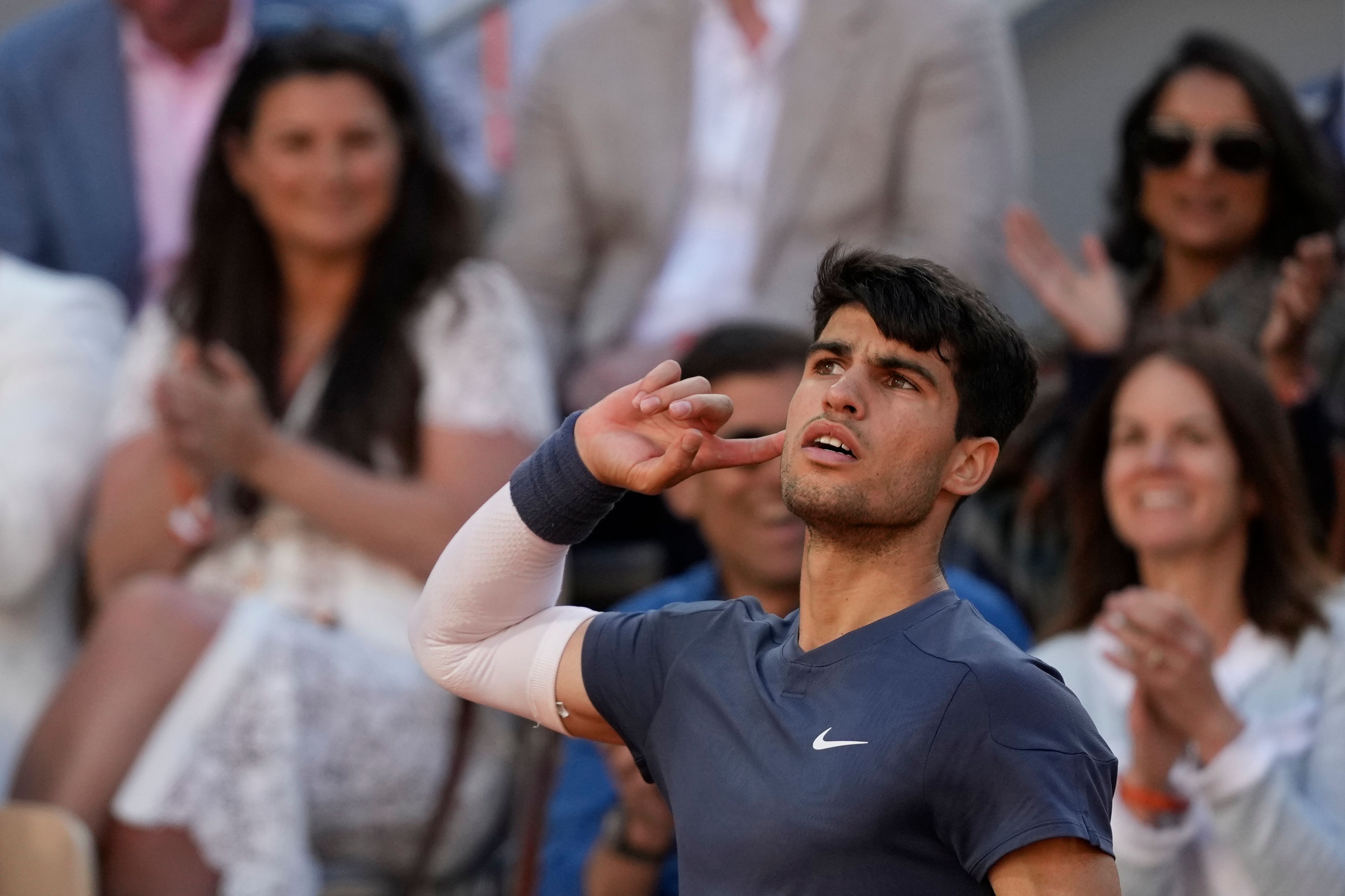 Spain's Carlos Alcaraz reacts as he plays against Germany's Alexander Zverev during the men's final match of the French Open tennis tournament at the Roland Garros stadium in Paris, Sunday, June 9, 2024.