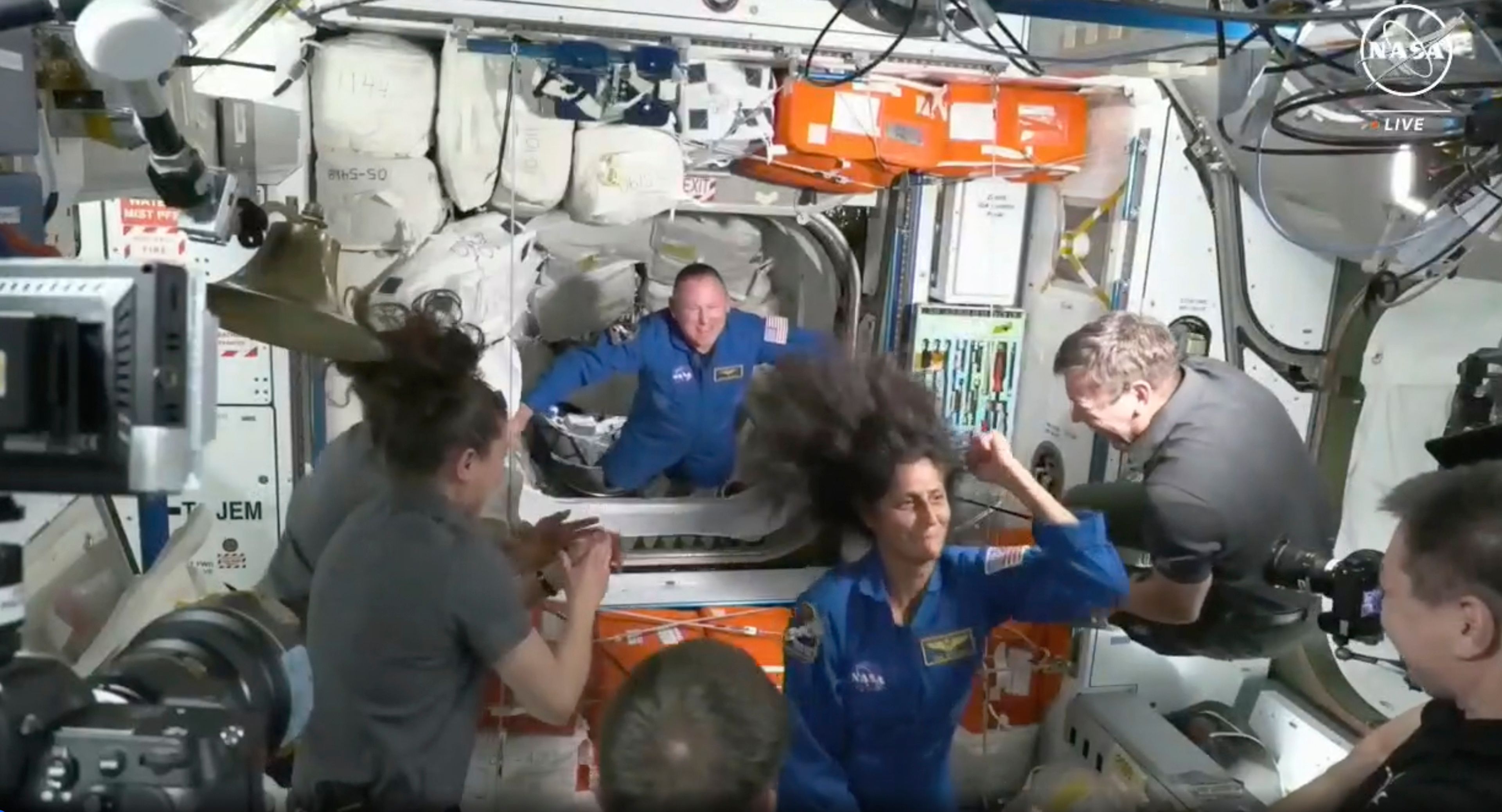 NASA astronauts Butch Wilmore and Suni Williams are greeted by the crew of the International Space Station on Thursday, June 6, 2024.