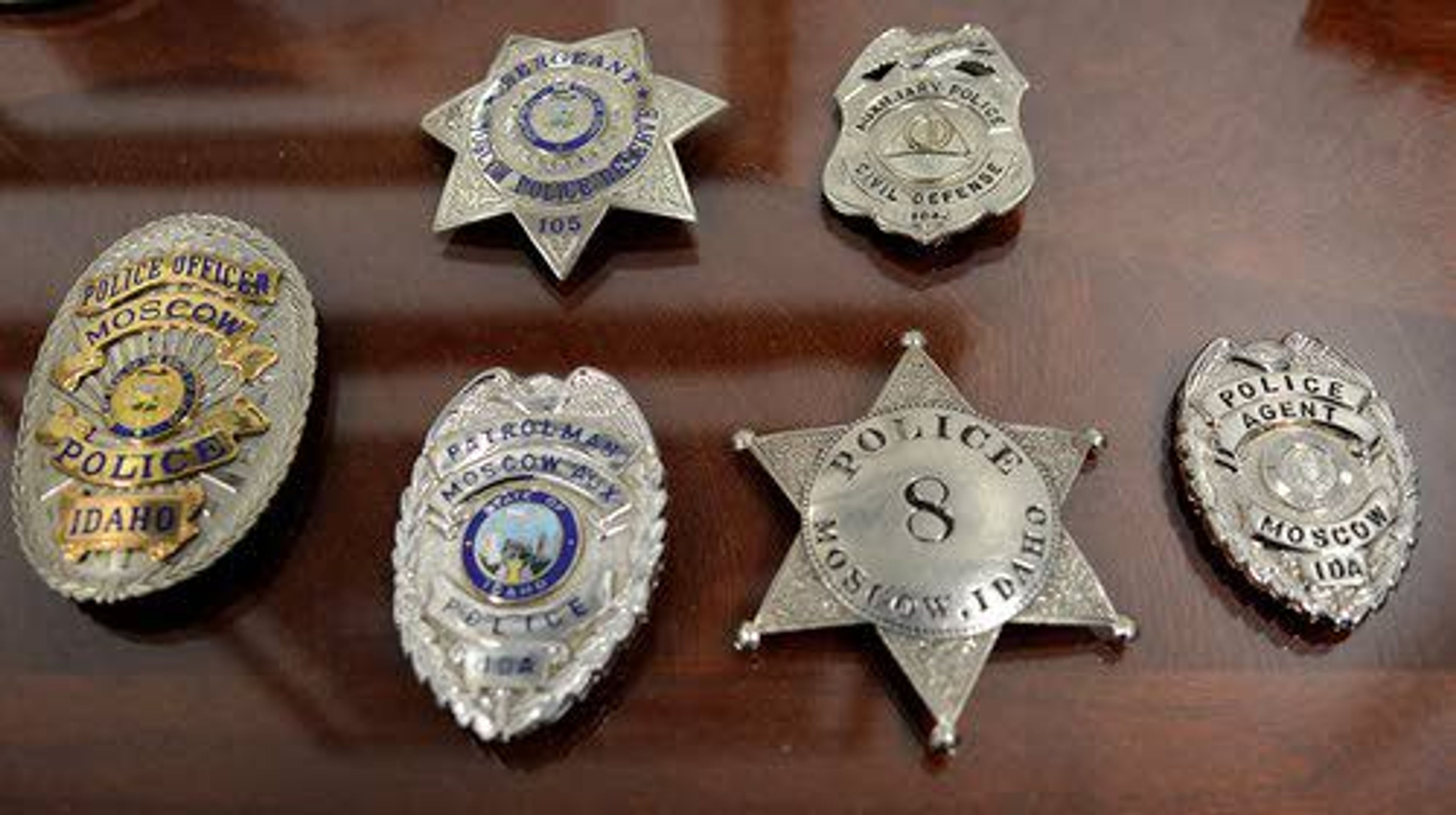 A collection of shields and badges shows the progression of the Moscow Police Department through its 125 years of service.