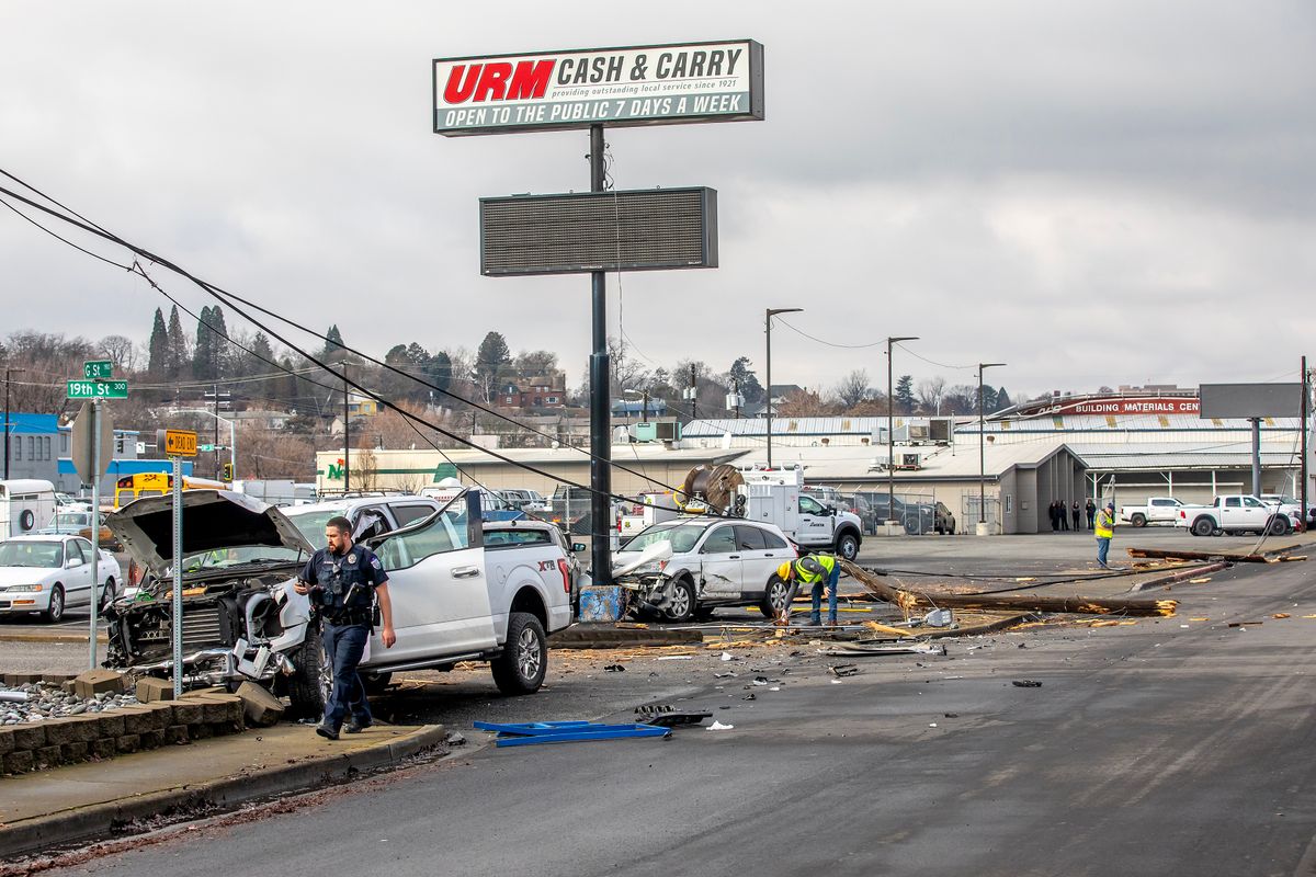 Two people taken to hospital after crashing into three poles...