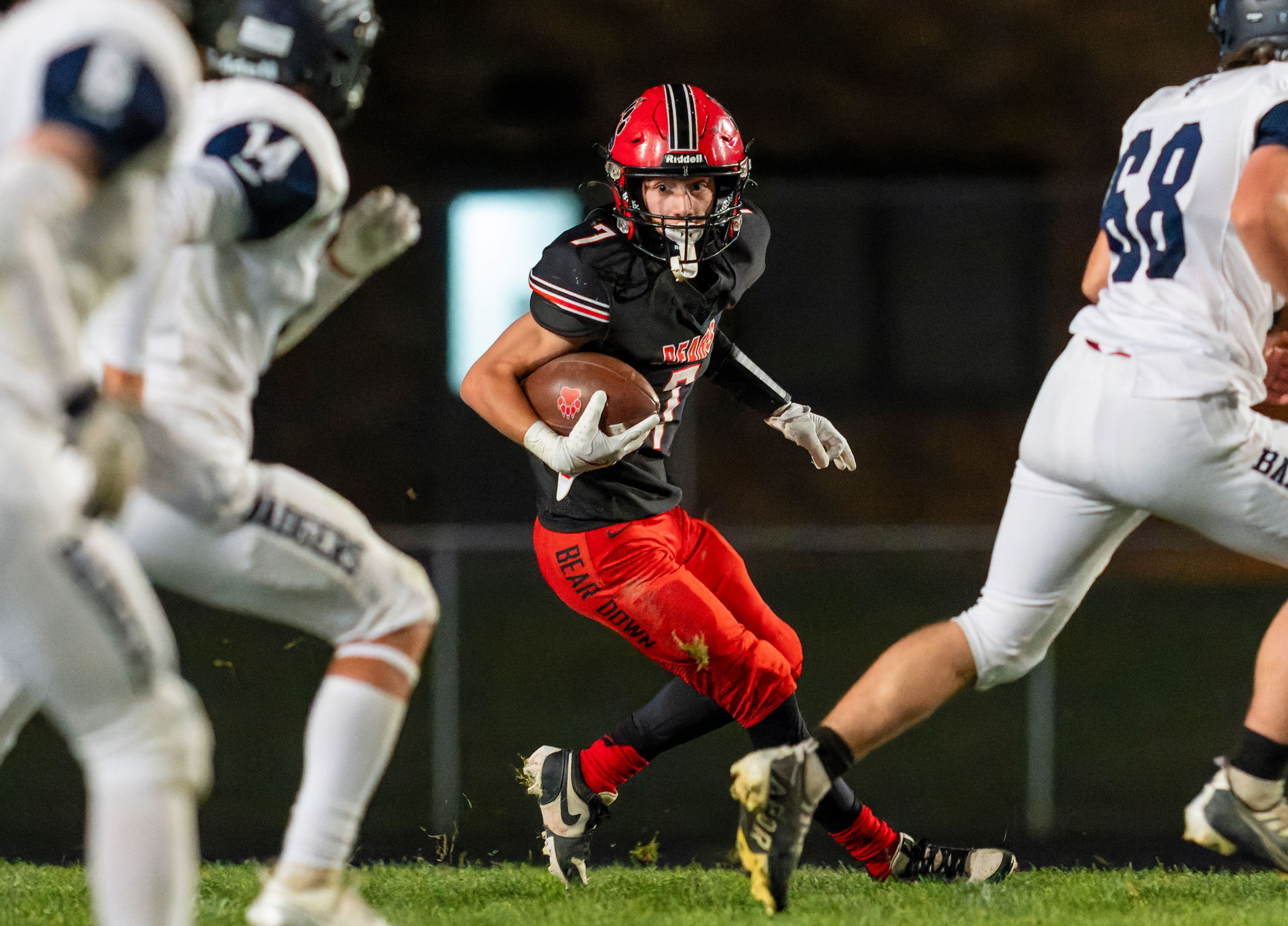 Moscow running back Keaton Frei (7) runs the ball during a game against the Bonners Ferry Badgers on Friday night at Bear Field in Moscow.