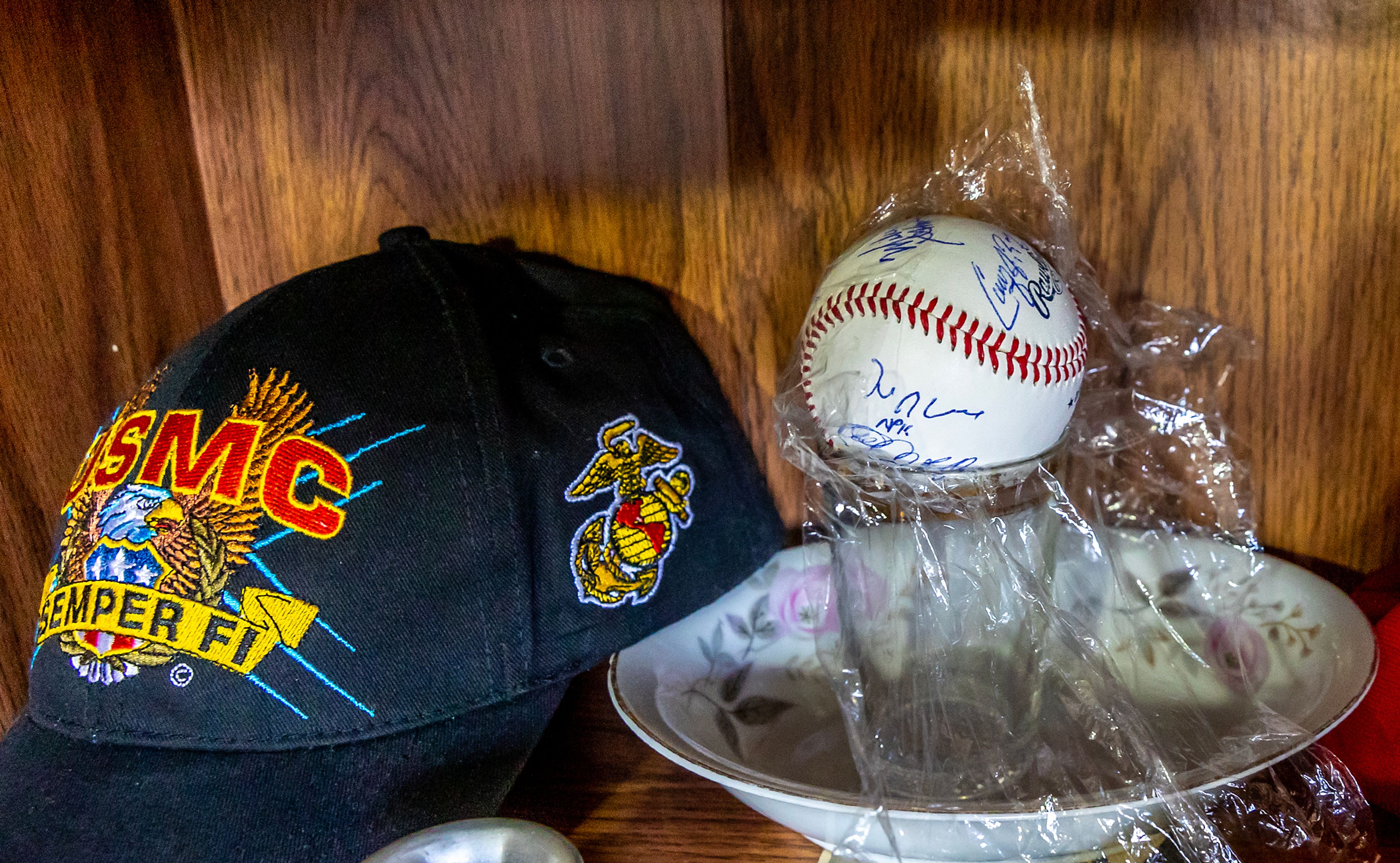 A signed baseball that Johnny Wells threw at the NAIA World Series sits on a shelf Tuesday in Clarkston.,