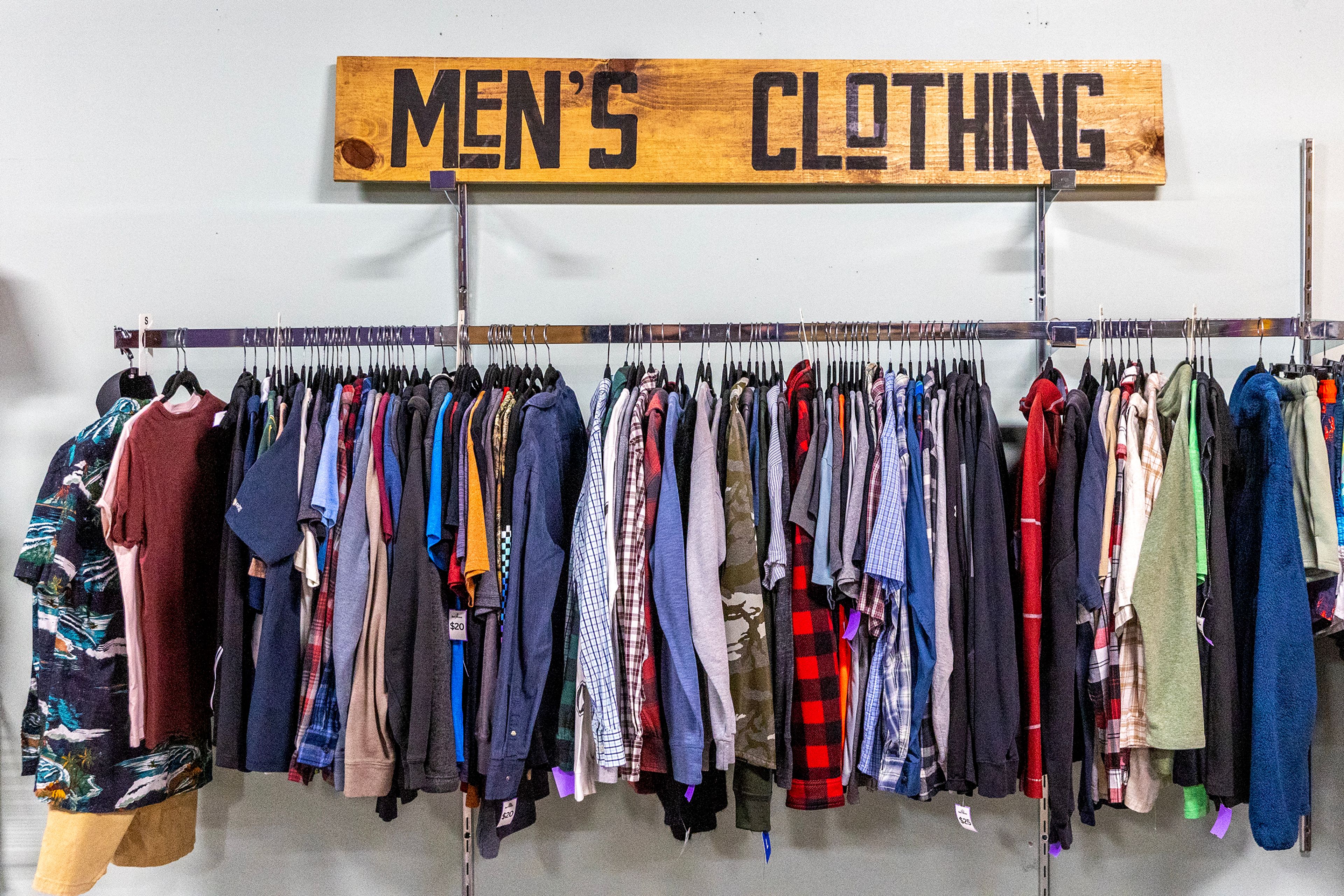 Men’s clothing sits on a wall at Bee’s Knees Resale Thursday in Lewiston.