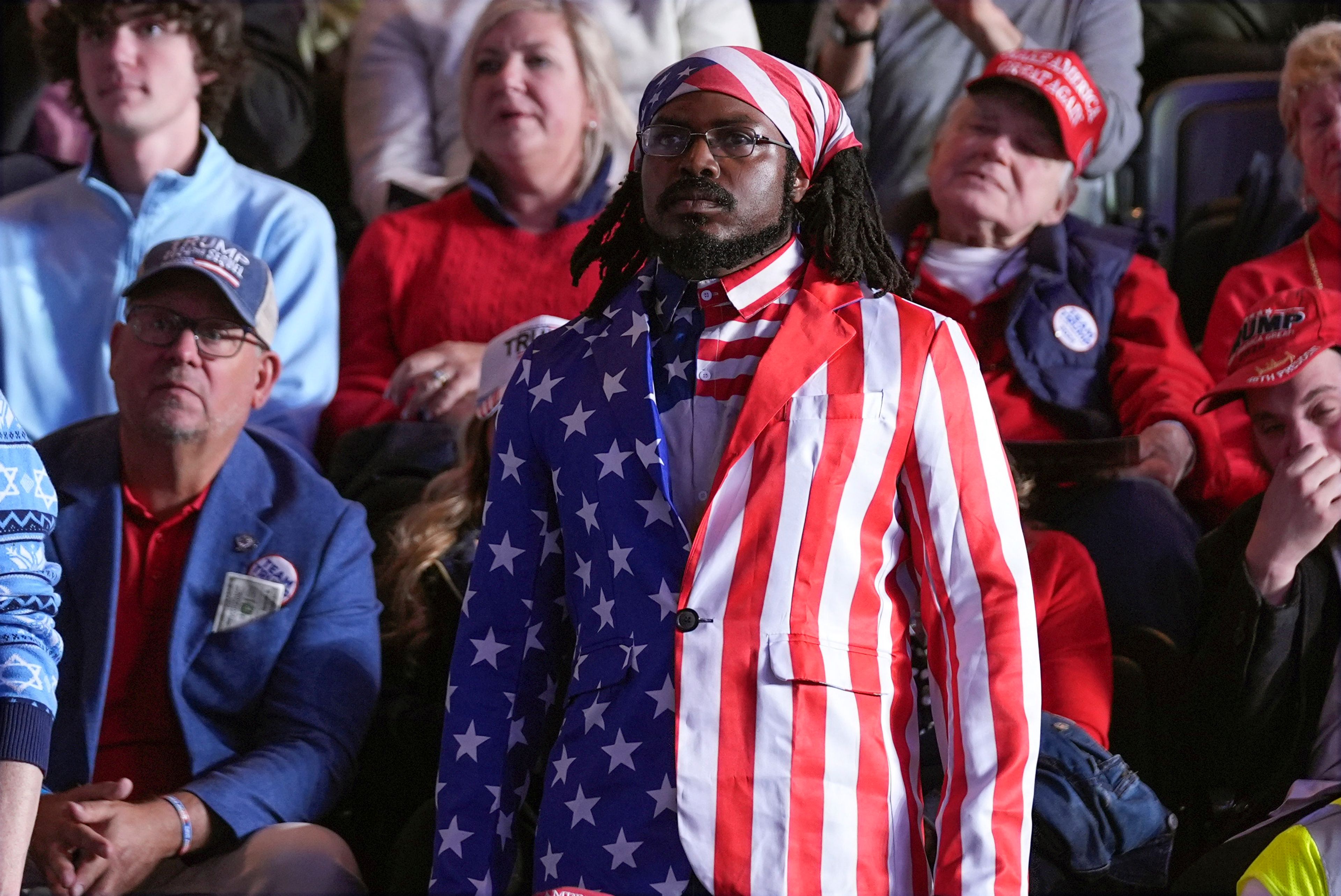 Supporters listen as Republican presidential nominee former President Donald Trump speaks during a campaign rally at Santander Arena, Monday, Nov. 4, 2024, in Reading, Pa. (AP Photo/Evan Vucci)