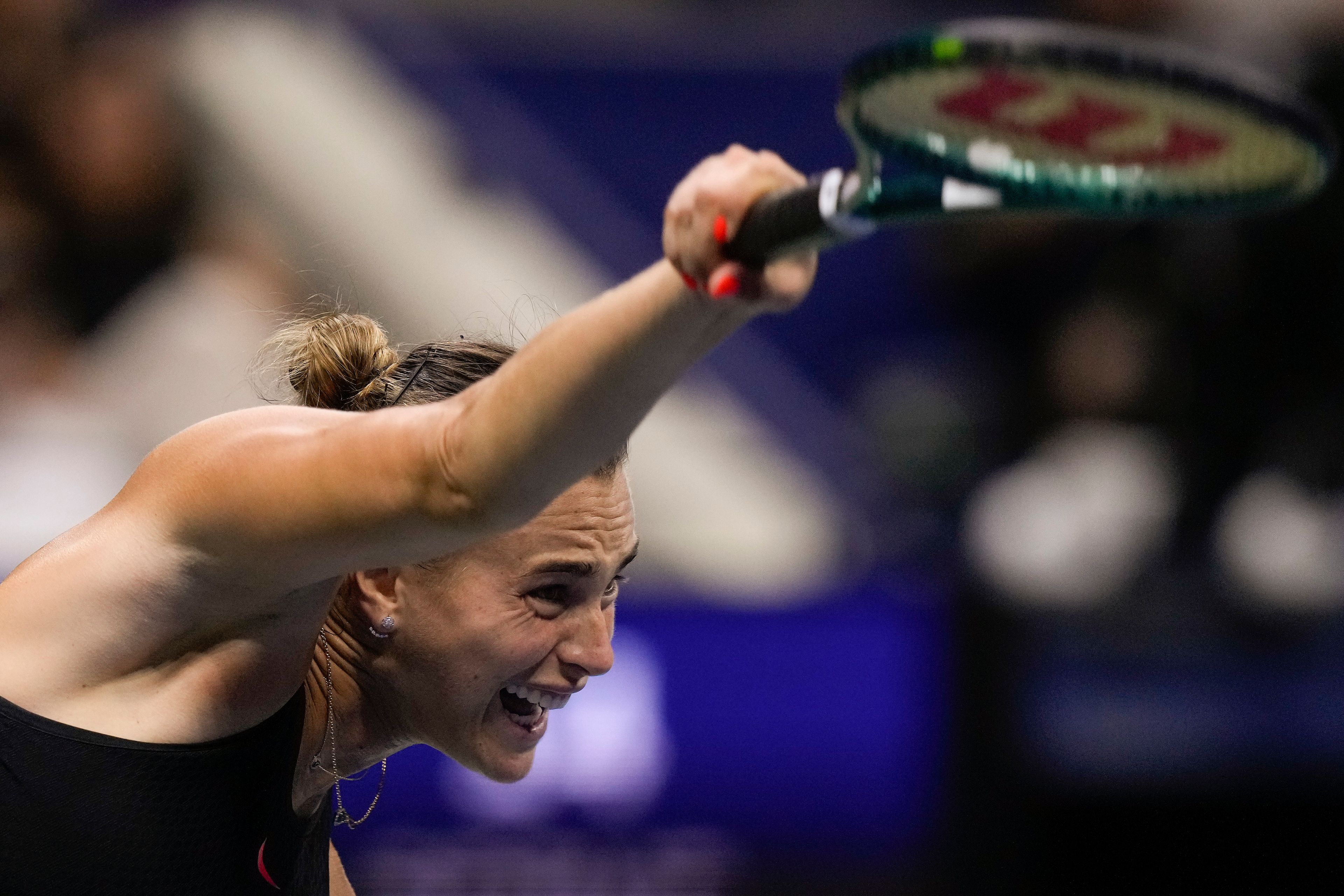 Aryna Sabalenka, of Belarus, serves to Emma Navarro, of the United States, during the women's singles semifinals of the U.S. Open tennis championships, Thursday, Sept. 5, 2024, in New York.