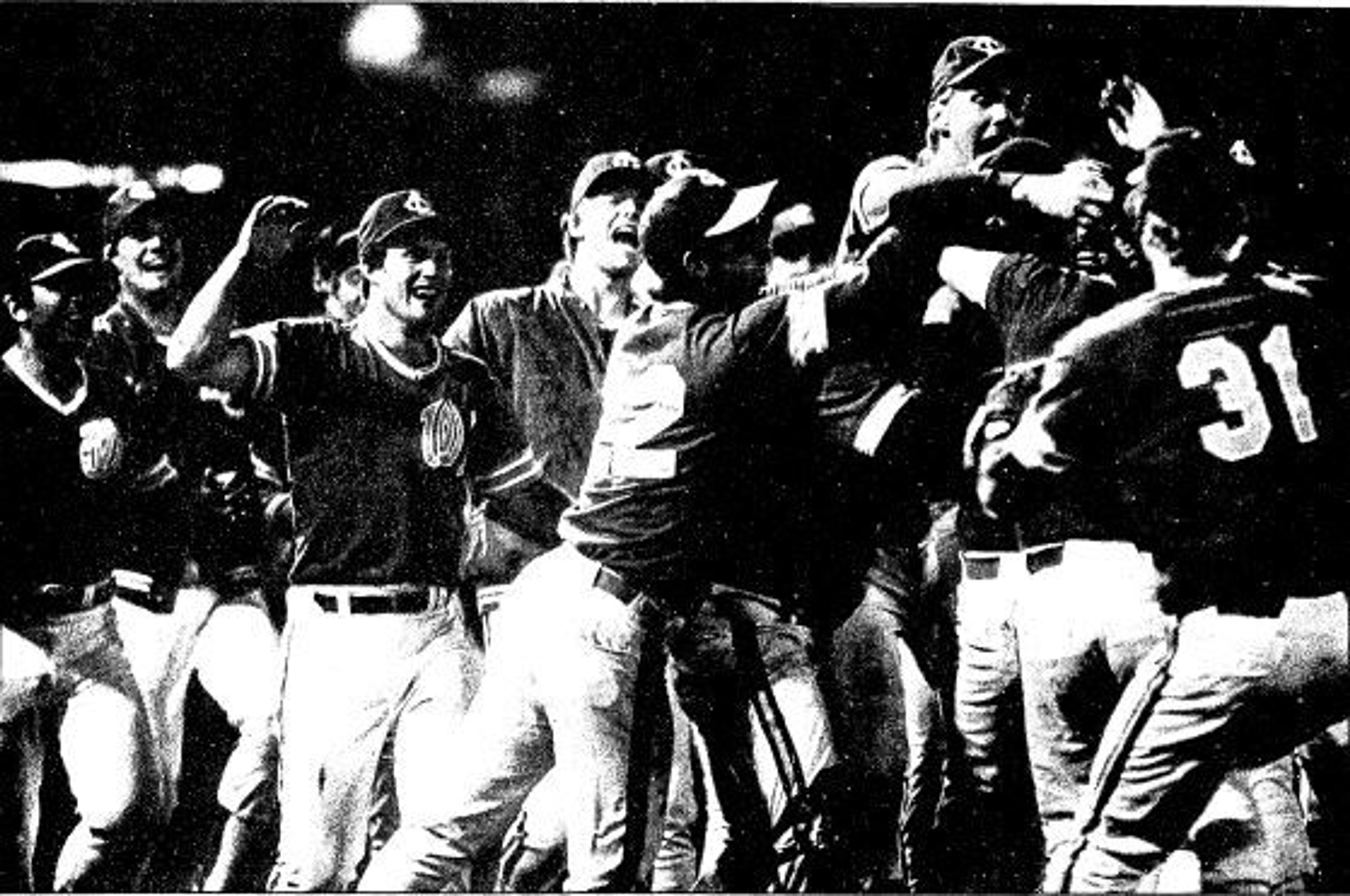 We won! We won! Triumphant Lewis-Clark State players mob each other in the middle of Harris Field Tuesday night after getting the final out in a 15-2 defeat of Azusa Pacific in the championship game of the NAIA baseball World Series. The championship is the school’s first after three runnerup finishes.