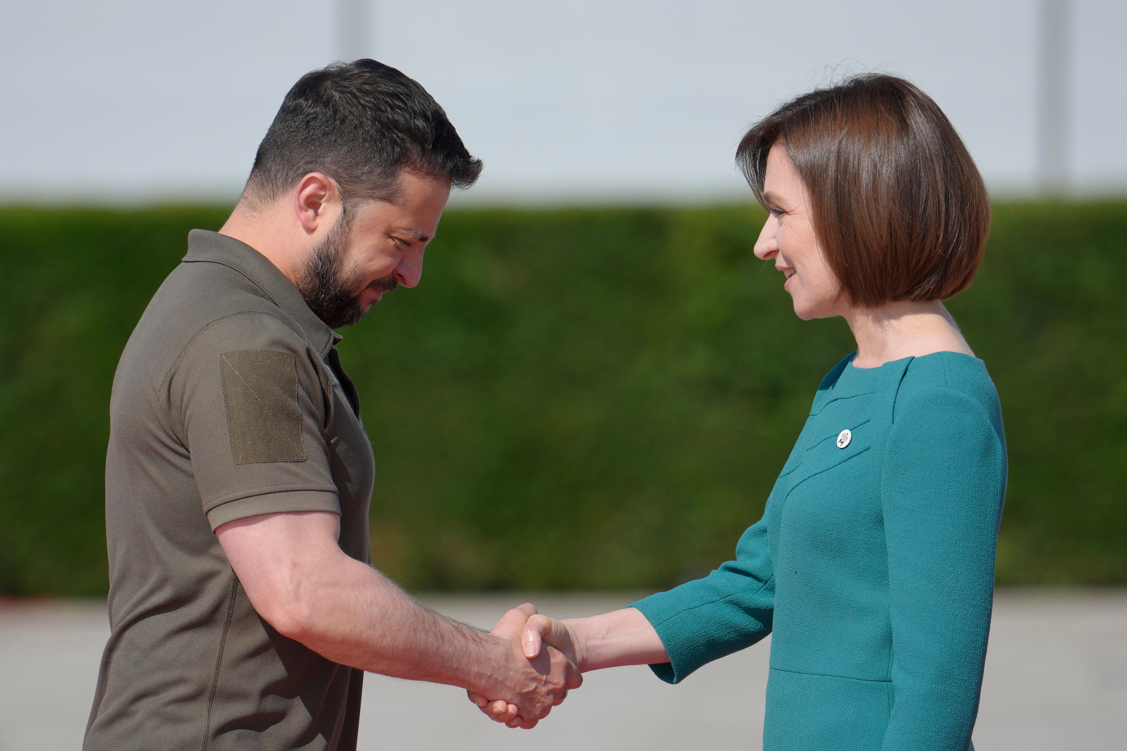 FILE - Moldova's President Maia Sandu, right, greets Ukraine's President Volodymyr Zelenskyy in Bulboaca, Moldova, June 1, 2023. She has been a frequent target of online disinformation created with artificial intelligence. (AP Photo/Vadim Ghirda, File)