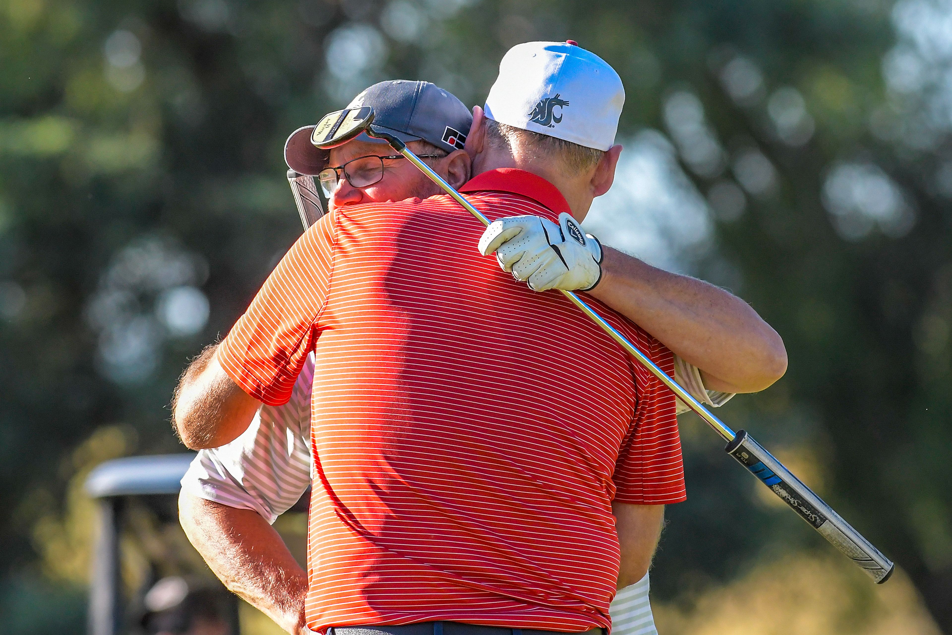 Kyle Nelson hugs Kevin Peterson after defeating him at the annual Moscow Elks Lodge Golf Club Sole Survivor tournament Thursday in Moscow.