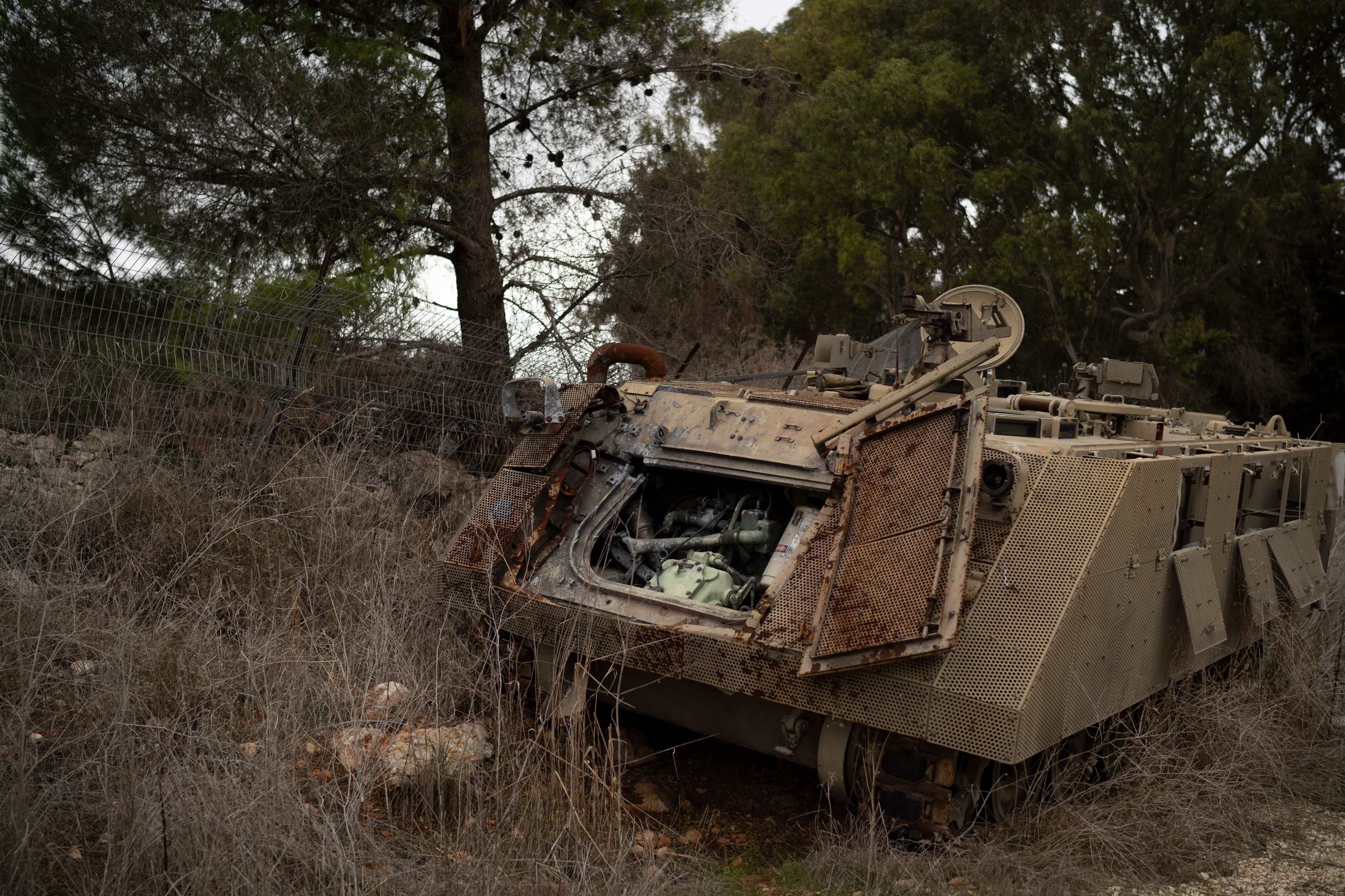 A damaged Israeli armoured personnel carrier (APC) stands on an area near the Israeli-Lebanese border, northern Israel, Wednesday, Nov. 27, 2024. (AP Photo/Leo Correa)