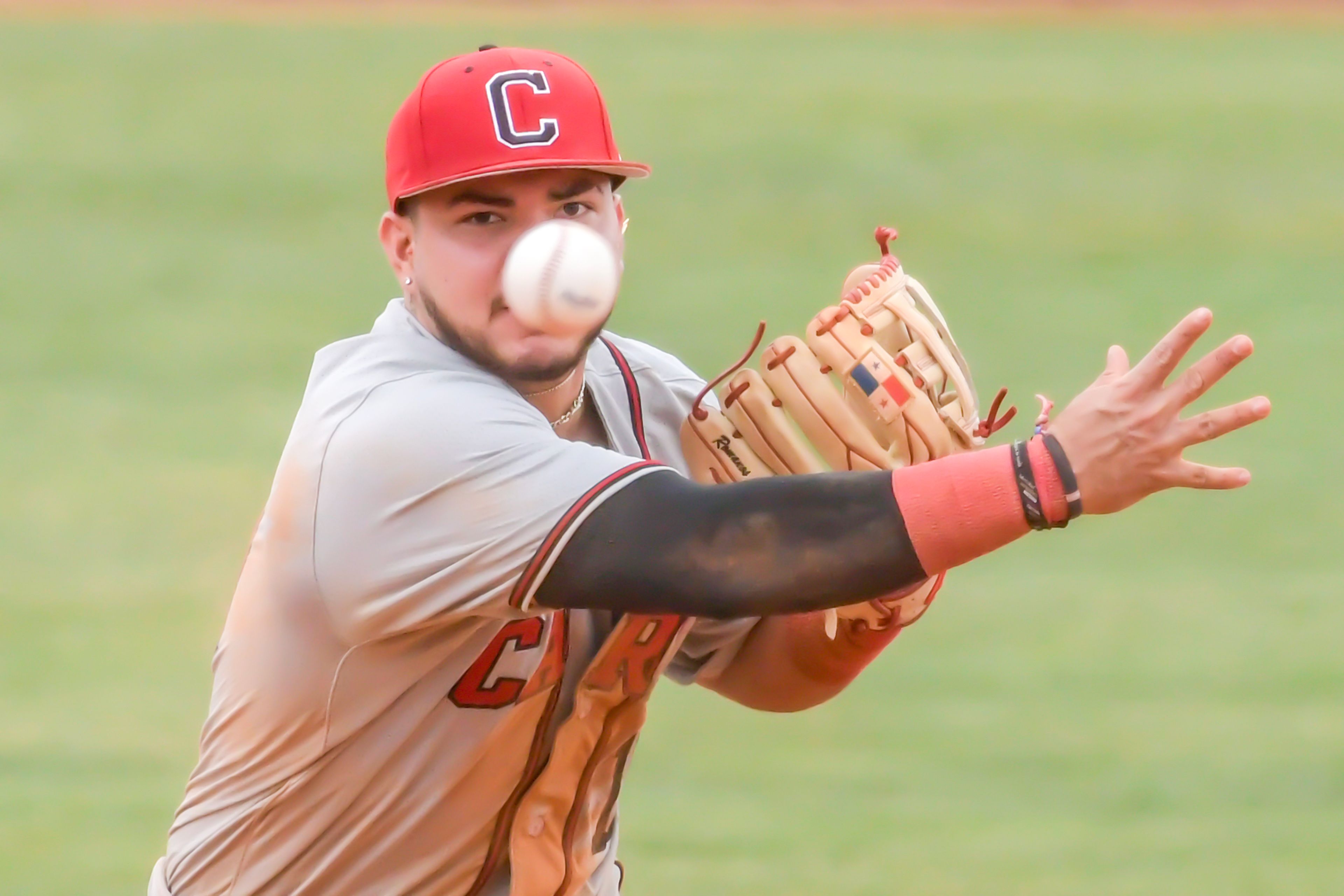 William Carey second baseman Rigoberto Hernandez throws to first against Cumberlands in an inning of game 6 of the NAIA World Series at Harris Field on  Saturday in Lewiston.