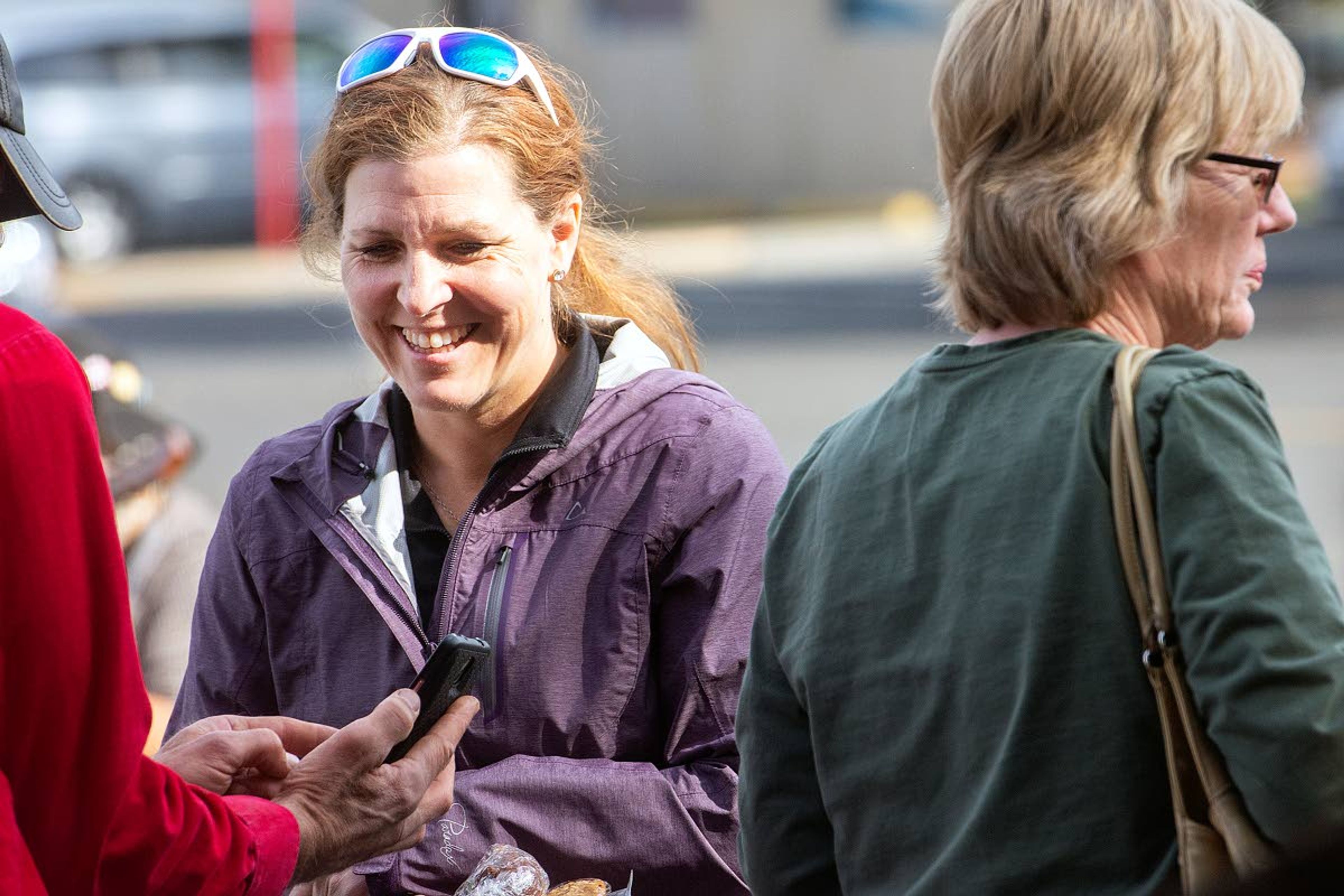 Clarkston Farmers Market manager Danielle Evans talks with a vendor on Saturday morning at the market in Clarkston.