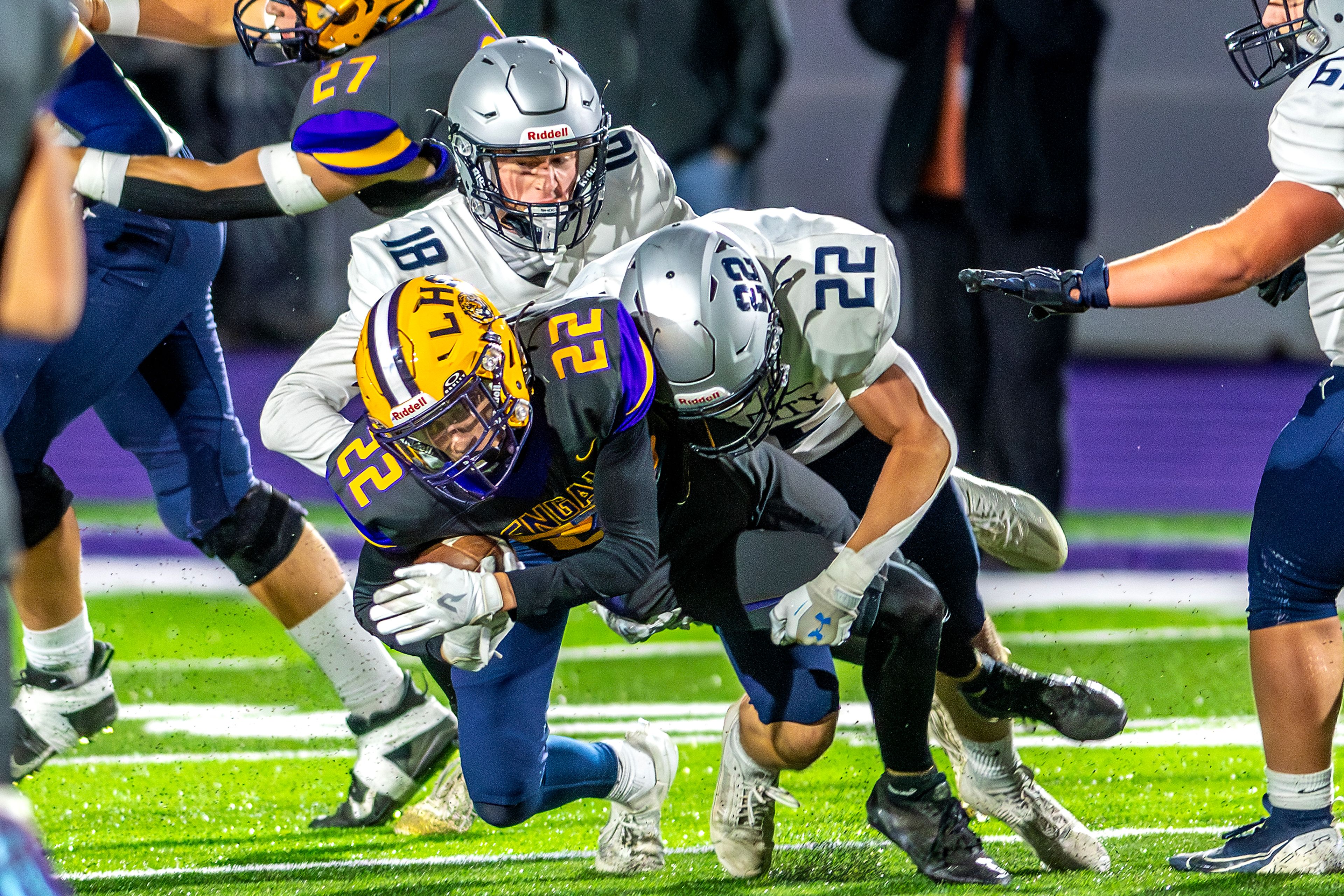 Lewiston wide reciter Gage Steiner is tackled by Lake City defensive back Gabe Wullenwaber in a nonconference game Friday at Lewiston High School.,