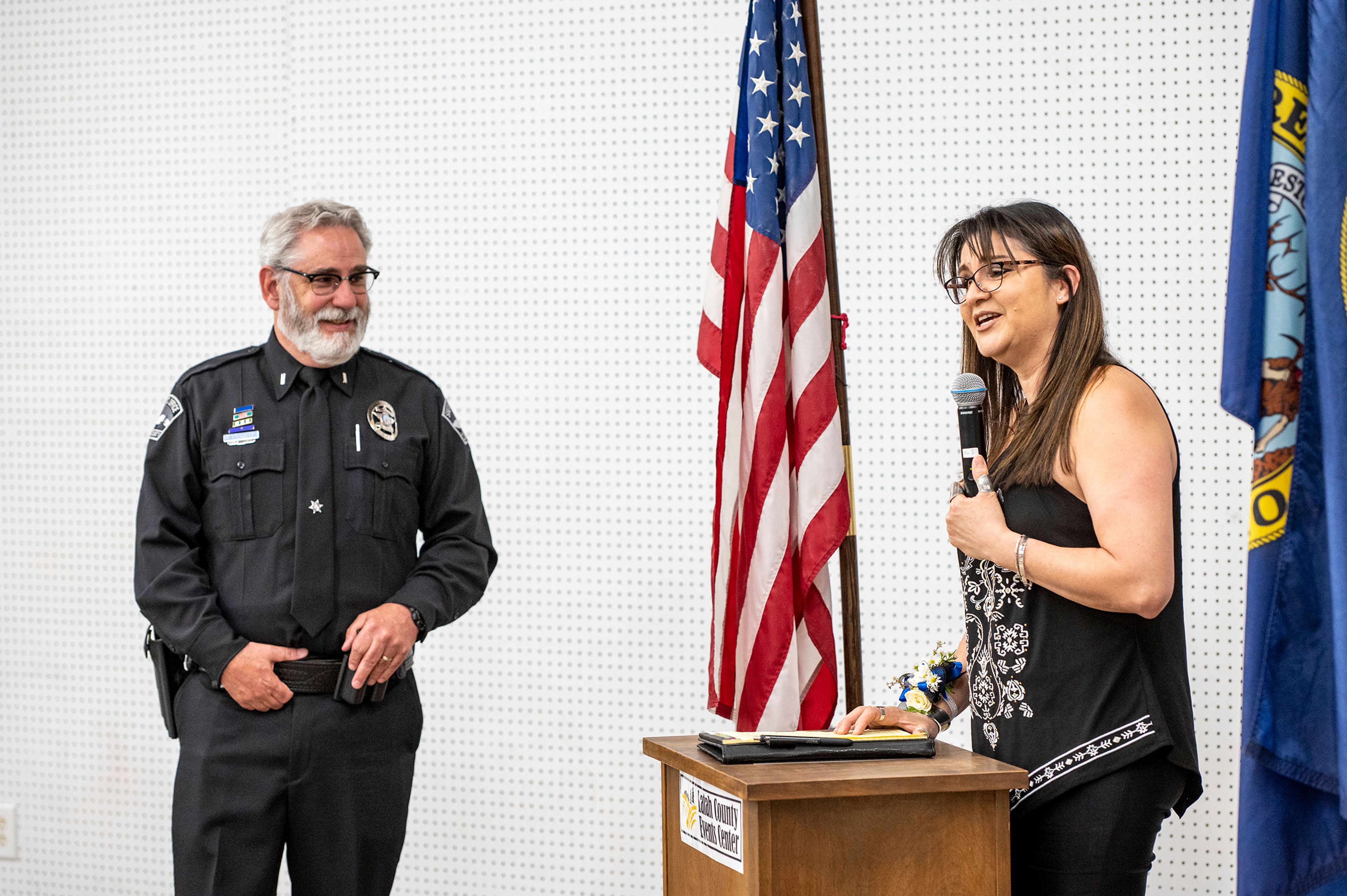 Belen Jordan speaks about her husband, Lt. Brannon Jordan, during Jordan’s retirement party on Thursday at the Latah County Fair Office in Moscow.