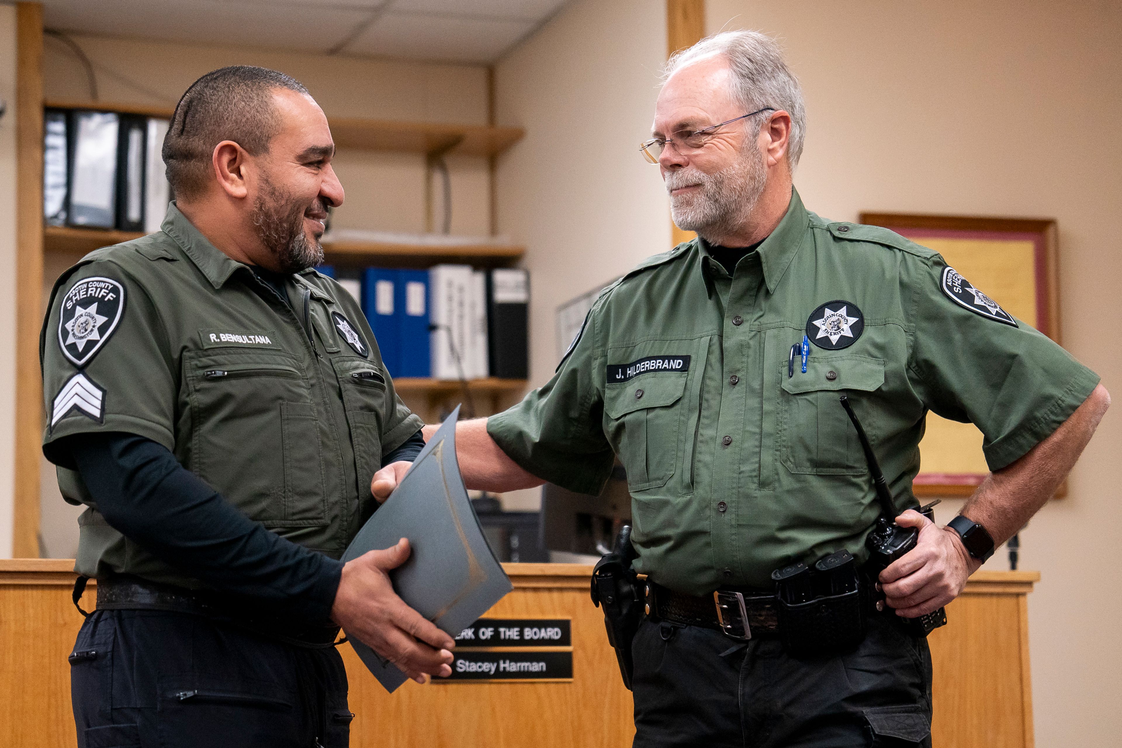 Asotin County Sheriff John Hilderbrand, right, congratulates Rashid Bensultana as he is promoted to Sergeant on Thursday afternoon inside the Asotin County Courthouse Annex.