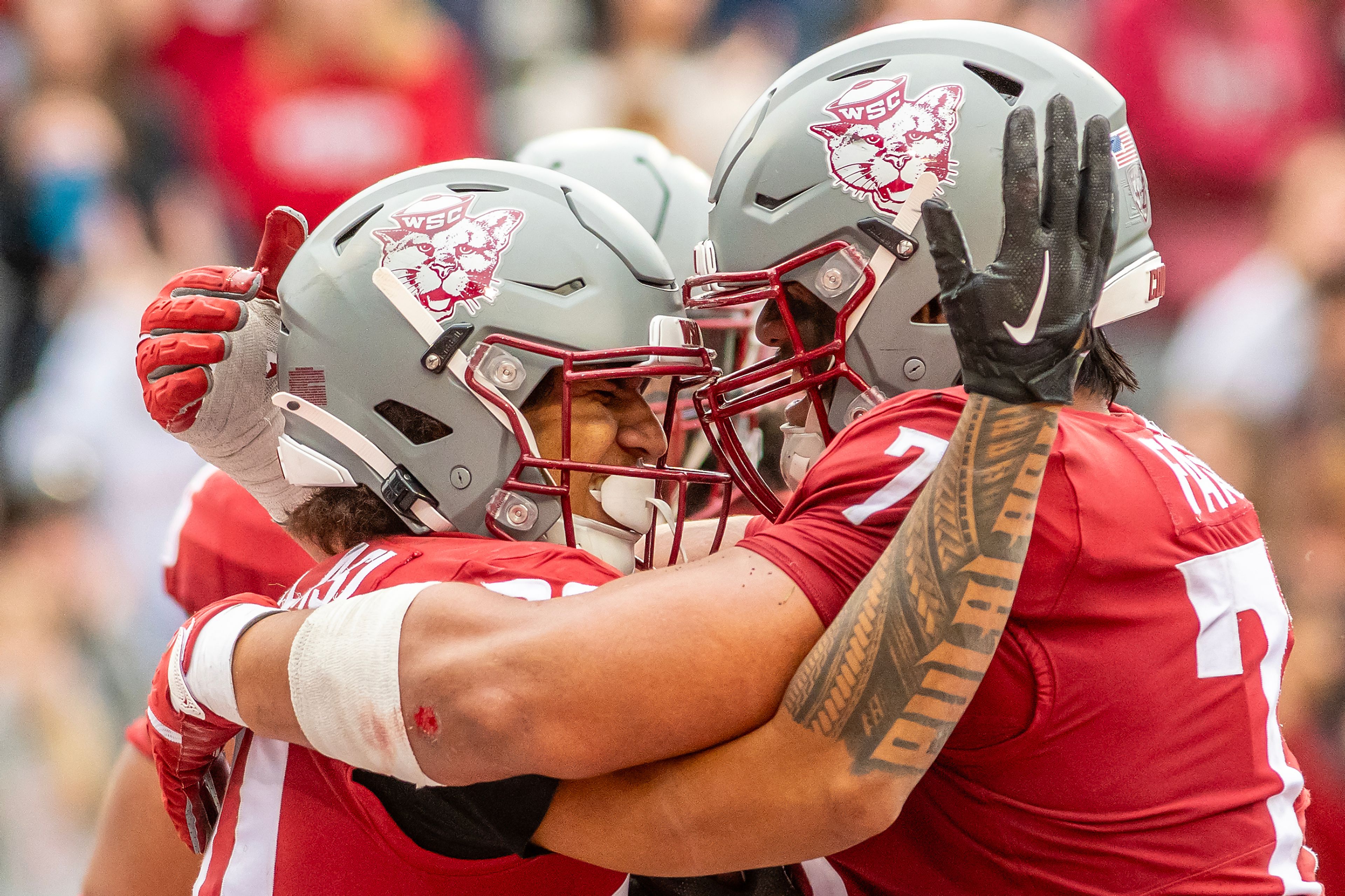 Washington State running back Leo Pulalasi Celebrates a touchdown with offensive lineman Fa'alili Fa'amoe against Hawaii in a college football game on Saturday at Gesa Field in Pullman. WSU defeated Hawaii 42-10.,