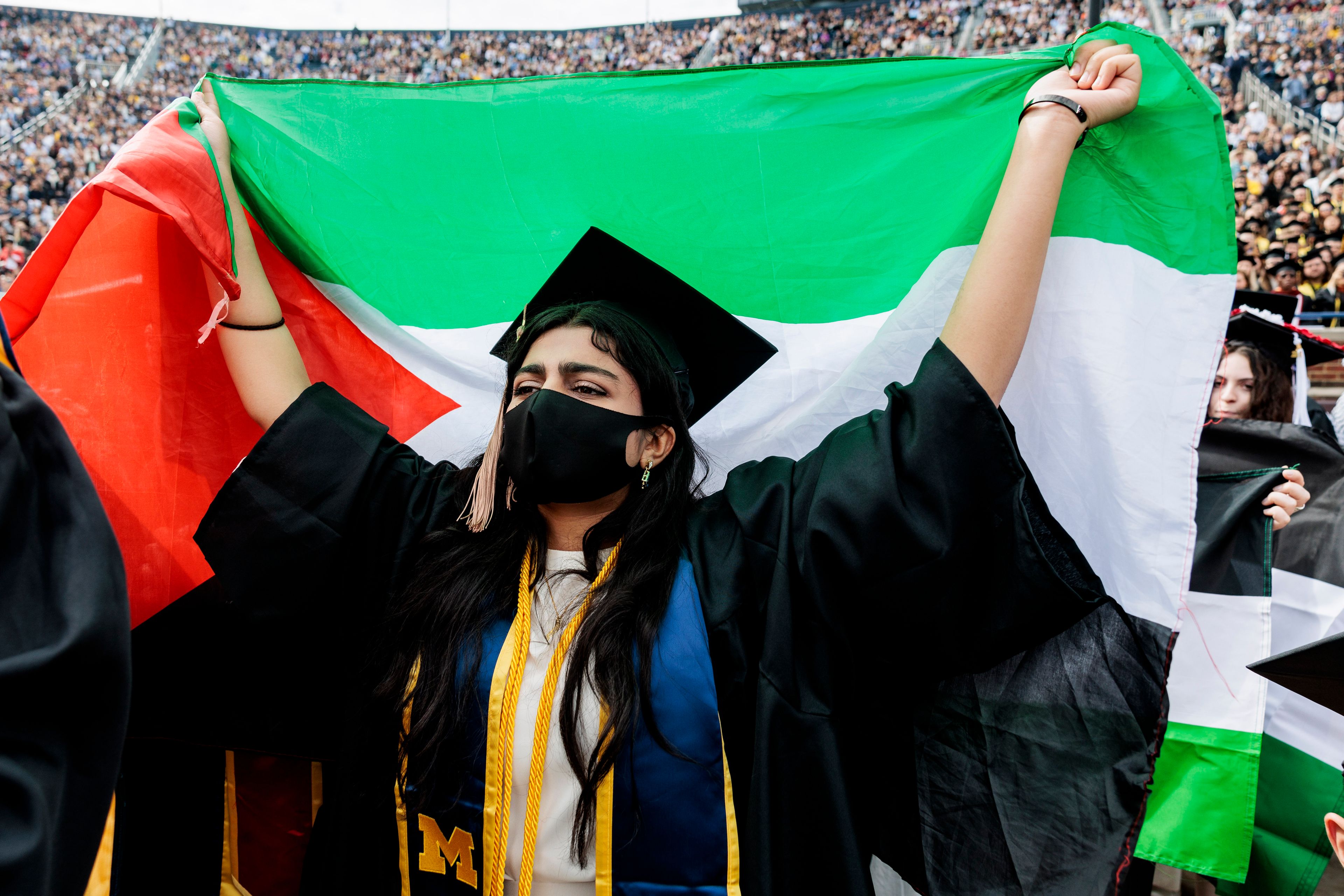 Pro-Palestinian protesters demonstrate during the University of Michigan's Spring 2024 Commencement Ceremony at Michigan Stadium in Ann Arbor, Mich., on Saturday, May 4, 2024.( Jacob Hamilton/Ann Arbor News via AP)