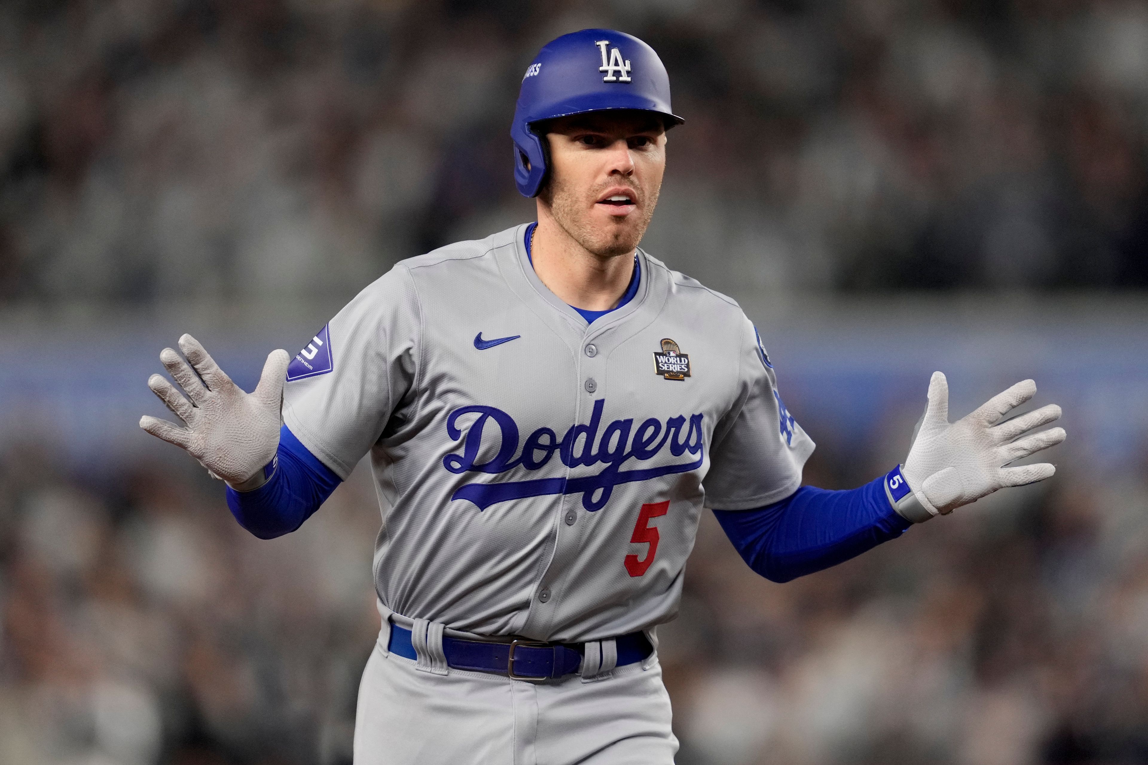 Los Angeles Dodgers' Freddie Freeman celebrates a two-run home run against the New York Yankees during the first inning in Game 3 of the baseball World Series, Monday, Oct. 28, 2024, in New York. (AP Photo/Ashley Landis)